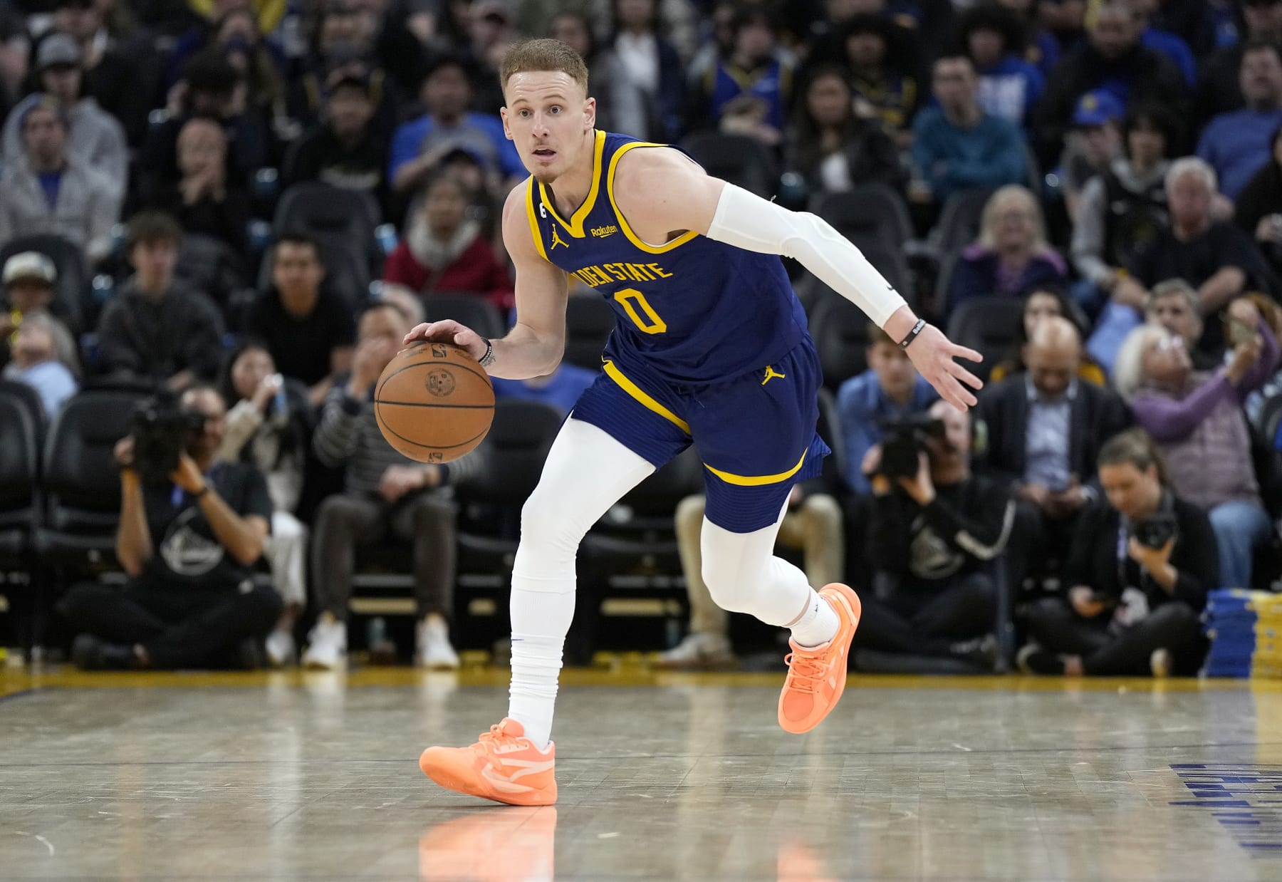 SAN FRANCISCO, CALIFORNIA - FEBRUARY 26: Donte DiVincenzo #0 of the Golden State Warriors dribbles the ball up court against the Minnesota Timberwolves during the third quarter of an NBA basketball game at Chase Center on February 26, 2023 in San Francisco, California. NOTE TO USER: User expressly acknowledges and agrees that, by downloading and or using this photograph, User is consenting to the terms and conditions of the Getty Images License Agreement. (Photo by Thearon W. Henderson/Getty Images)
