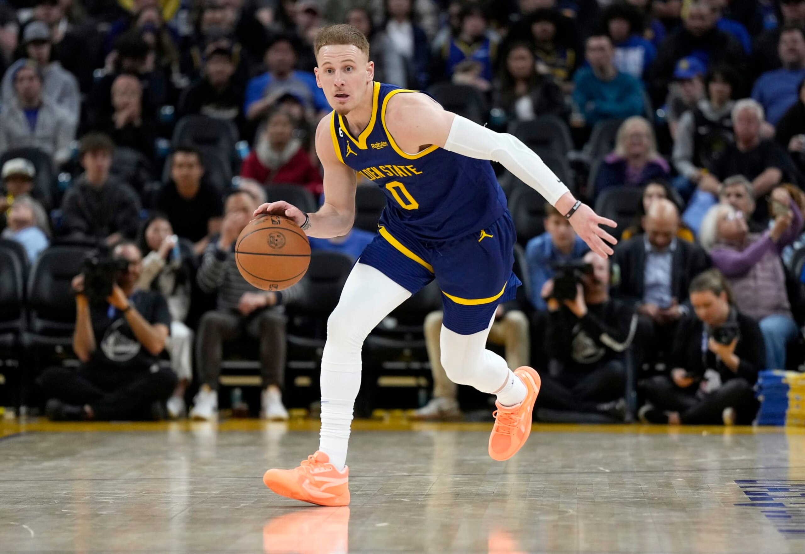 SAN FRANCISCO, CALIFORNIA - FEBRUARY 26: Donte DiVincenzo #0 of the Golden State Warriors dribbles the ball up court against the Minnesota Timberwolves during the third quarter of an NBA basketball game at Chase Center on February 26, 2023 in San Francisco, California. NOTE TO USER: User expressly acknowledges and agrees that, by downloading and or using this photograph, User is consenting to the terms and conditions of the Getty Images License Agreement. (Photo by Thearon W. Henderson/Getty Images)