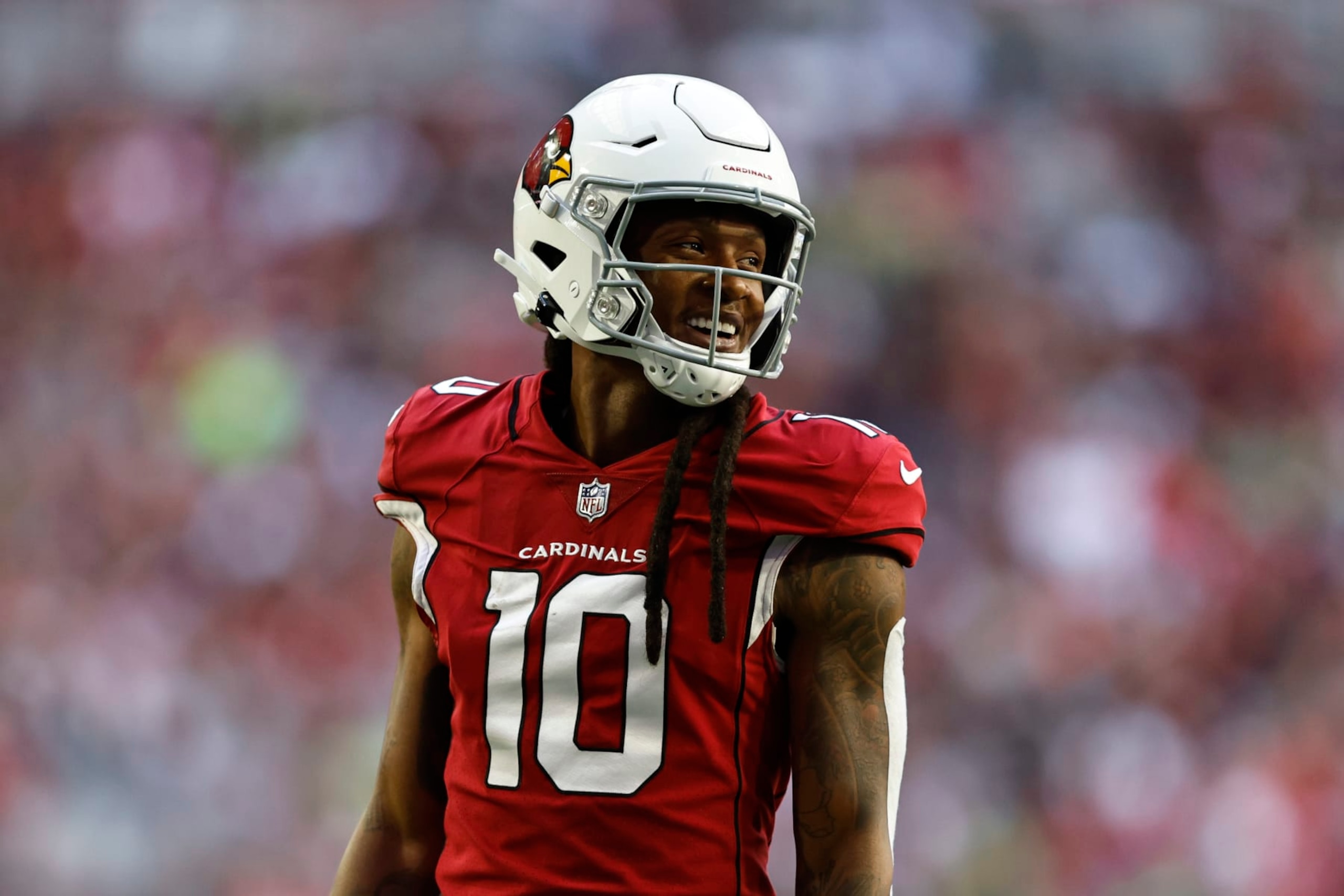 GLENDALE, ARIZONA - NOVEMBER 06: DeAndre Hopkins #10 of the Arizona Cardinals reacts as he looks on during an NFL Football game between the Arizona Cardinals and the Seattle Seahawks at State Farm Stadium on November 06, 2022 in Glendale, Arizona. (Photo by Michael Owens/Getty Images)