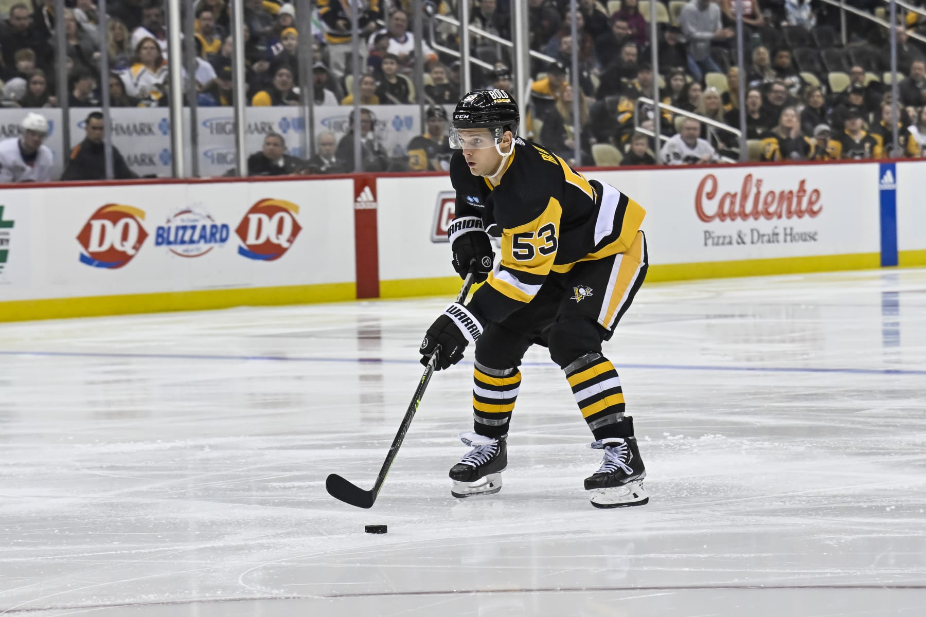 PITTSBURGH, PA - FEBRUARY 20: Pittsburgh Penguins Center Teddy Blueger (53) skates with the puck during the third period in the NHL game between the Pittsburgh Penguins and the New York Islanders on February 20, 2023, at PPG Paints Arena in Pittsburgh, PA. (Photo by Jeanine Leech/Icon Sportswire via Getty Images)