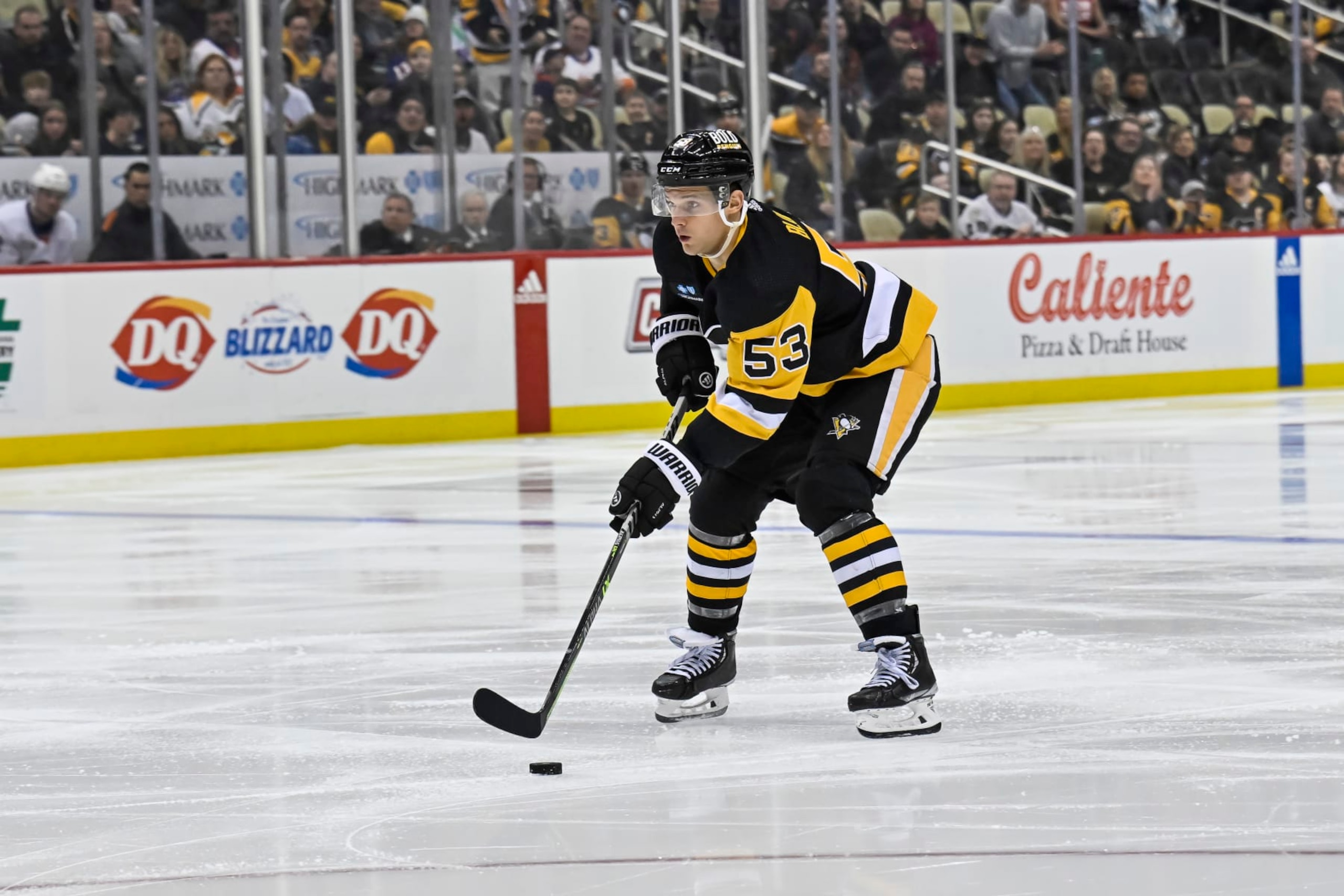 PITTSBURGH, PA - FEBRUARY 20: Pittsburgh Penguins Center Teddy Blueger (53) skates with the puck during the third period in the NHL game between the Pittsburgh Penguins and the New York Islanders on February 20, 2023, at PPG Paints Arena in Pittsburgh, PA. (Photo by Jeanine Leech/Icon Sportswire via Getty Images)