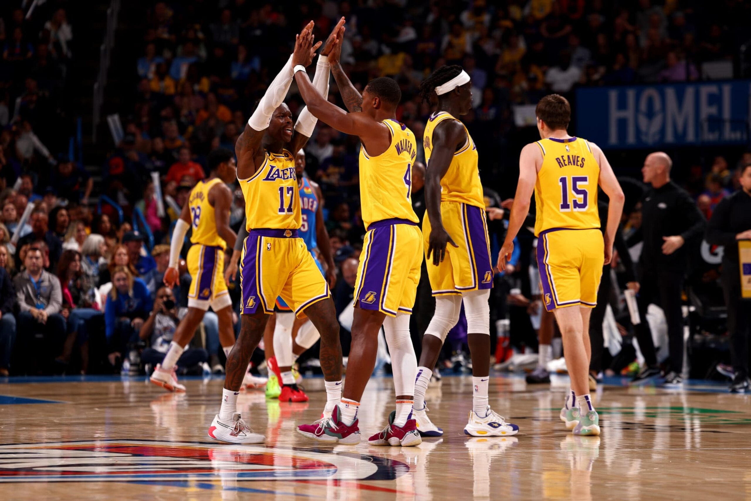 OKLAHOMA CITY, OK - MARCH 1: Dennis Schroder #17 and Lonnie Walker IV #4 of the Los Angeles Lakers high fives during the game against the Oklahoma City Thunder on March 1, 2023 at Paycom Arena in Oklahoma City, Oklahoma. NOTE TO USER: User expressly acknowledges and agrees that, by downloading and or using this photograph, User is consenting to the terms and conditions of the Getty Images License Agreement. Mandatory Copyright Notice: Copyright 2023 NBAE (Photo by Zach Beeker/NBAE via Getty Images)