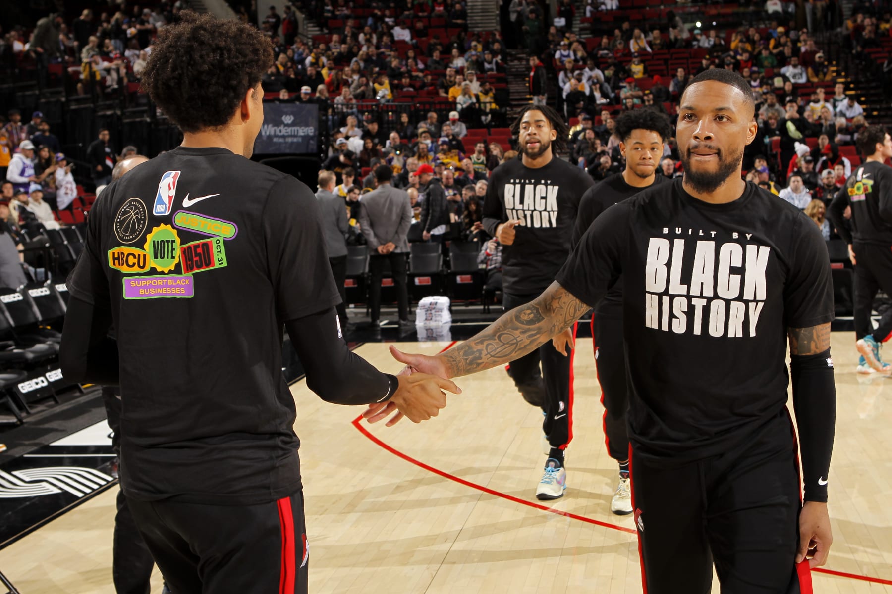 PORTLAND, OR - FEBRUARY 13: Matisse Thybulle #22 of the Portland Trail Blazers high fives Damian Lillard #0 of the Portland Trail Blazers prior to the game against the Los Angeles Lakers on February 13, 2023 at the Moda Center Arena in Portland, Oregon. NOTE TO USER: User expressly acknowledges and agrees that, by downloading and or using this photograph, user is consenting to the terms and conditions of the Getty Images License Agreement. Mandatory Copyright Notice: Copyright 2023 NBAE (Photo by Cameron Browne/NBAE via Getty Images)