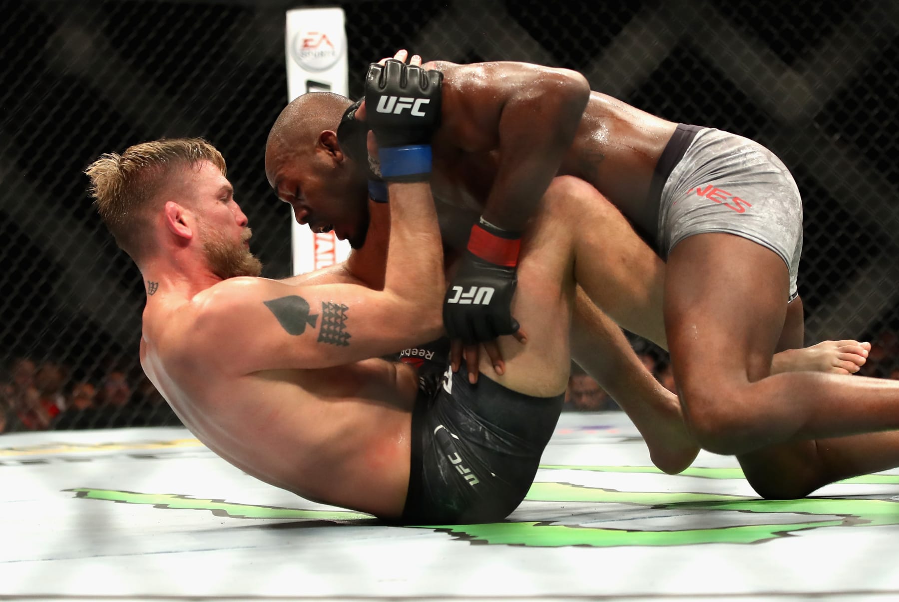 Jon Jones grapples with Alexander Gustafsson