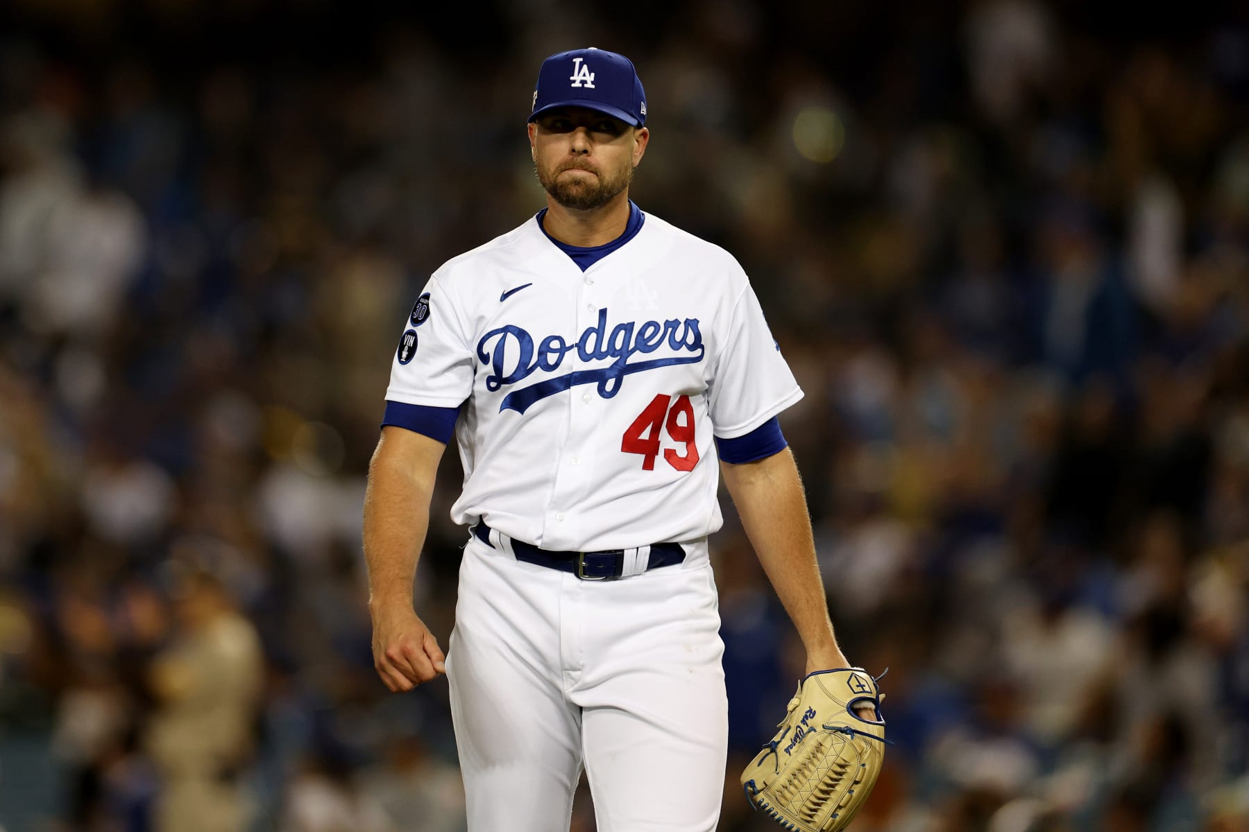 LOS ANGELES, CALIFORNIA - OCTOBER 12: Blake Treinen #49 of the Los Angeles Dodgers looks on during the eighth inning in game two of the National League Division Series against the San Diego Padres at Dodger Stadium on October 12, 2022 in Los Angeles, California. (Photo by Harry How/Getty Images)