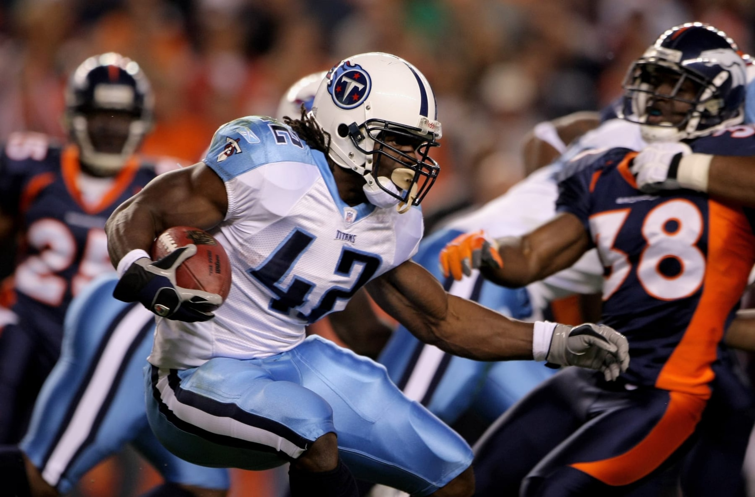 DENVER - NOVEMBER 19:  Chris Henry #42 of the Tennessee Titans returns a kick off against the Denver Broncos at Invesco Field at Mile High on November 19, 2007 in Denver, Colorado. The Broncos defeated the Titans 34-20.  (Photo by Doug Pensinger/Getty Images)