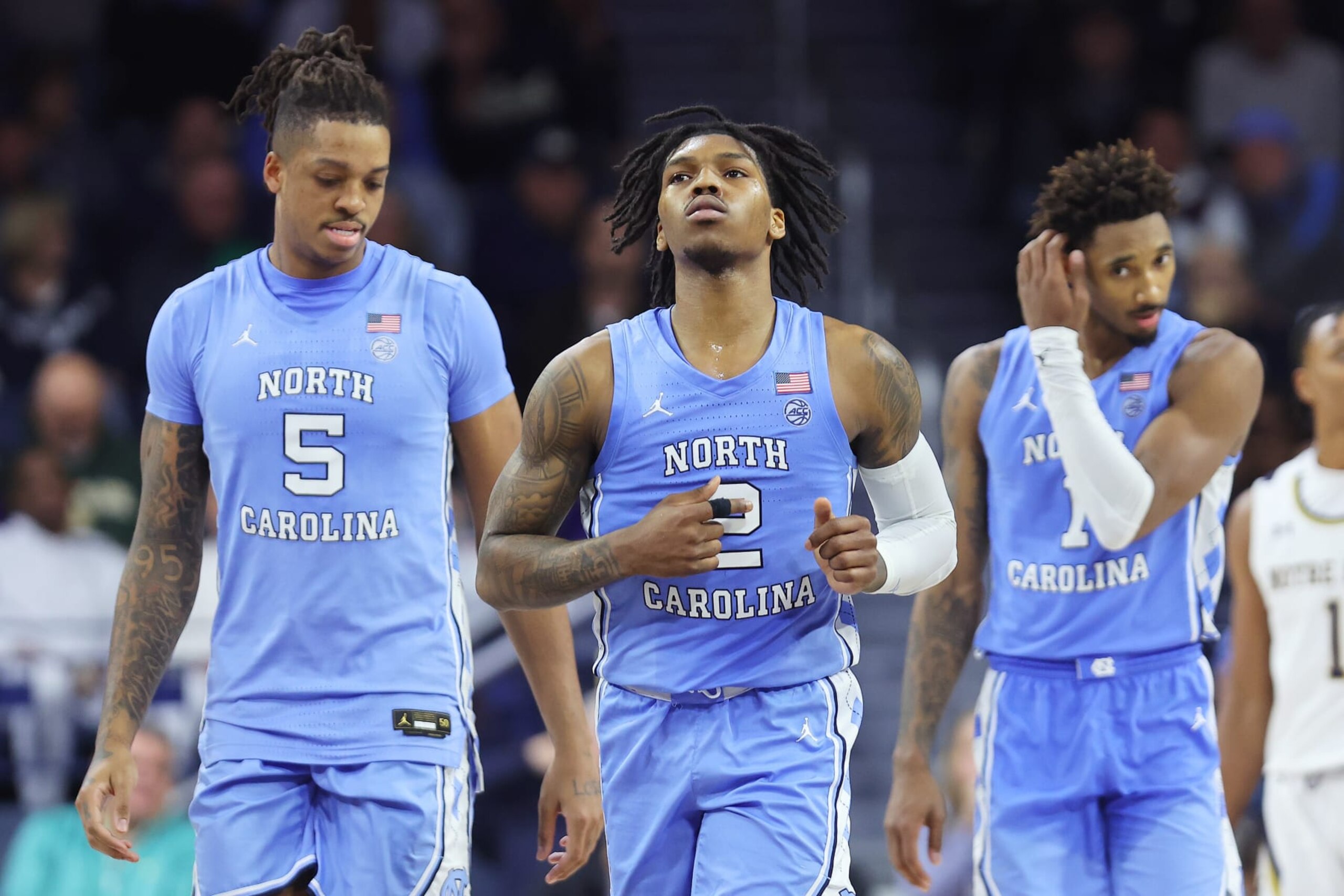 SOUTH BEND, INDIANA - FEBRUARY 22: Armando Bacot #5, Caleb Love #2 and Leaky Black #1 of the North Carolina Tar Heels look on against the Notre Dame Fighting Irish during the second half at Purcell Pavilion at the Joyce Center on February 22, 2023 in South Bend, Indiana. (Photo by Michael Reaves/Getty Images)