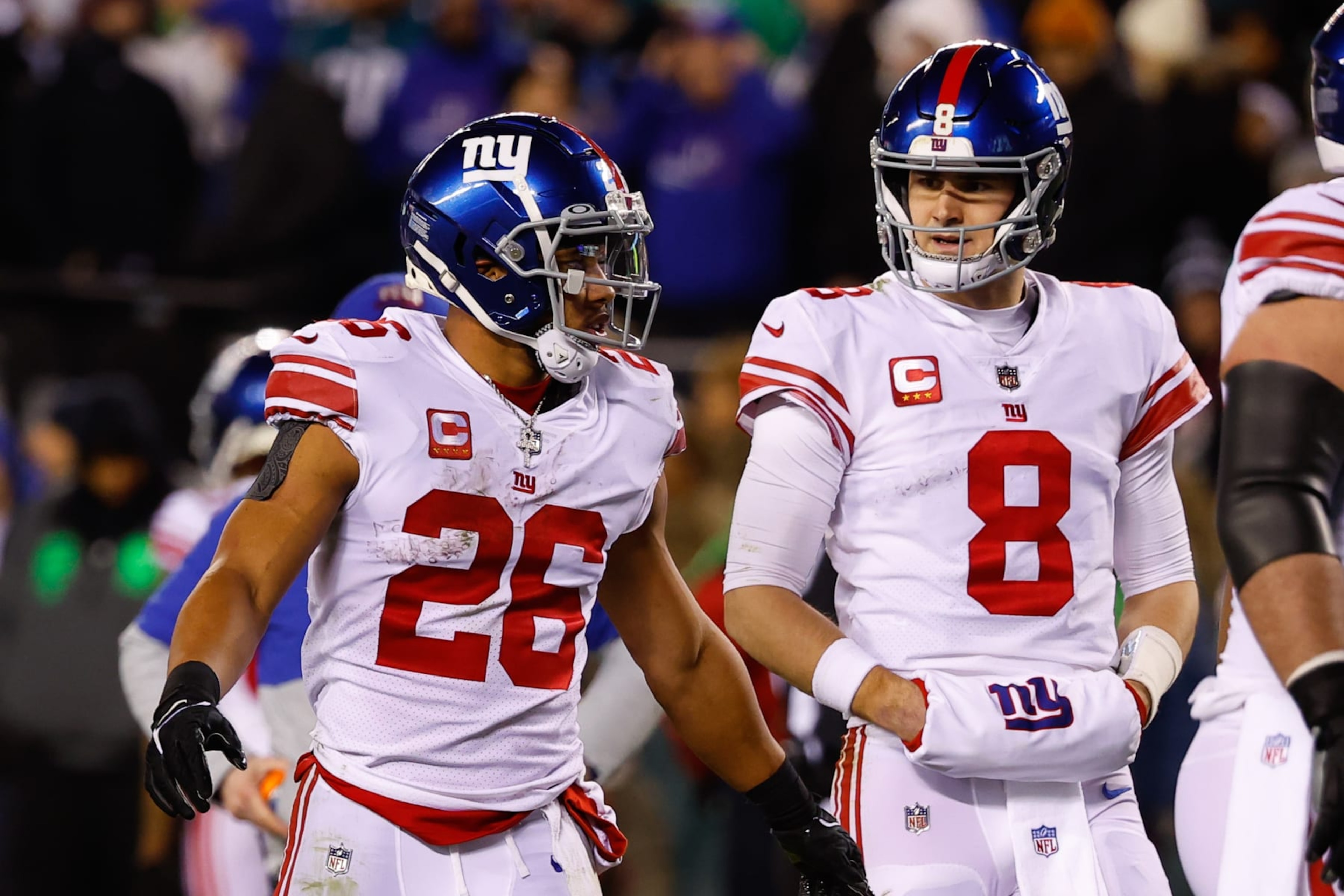 PHILADELPHIA, PA - JANUARY 21:  New York Giants running back Saquon Barkley (26) and New York Giants quarterback Daniel Jones (8) during the NFC Divisional playoff game between the Philadelphia Eagles and the New York Giants on January 21, 2023 at Lincoln Financial Field in Philadelphia, Pennsylvania.  (Photo by Rich Graessle/Icon Sportswire via Getty Images)