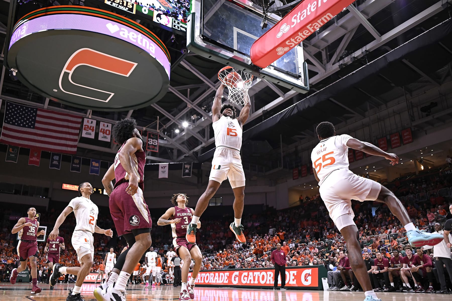 CORAL GABLES, FL - FEB 25: Miami forward Norchad Omier (15) dunks the ball in the first half (also pictured, Miami guard Wooga Poplar (55), guard Isaiah Wong (2); Florida State guard Darin Green, Jr. (22), forward Cam Corhen (3), guard Matthew Cleveland (35)) as the Miami Hurricanes faced the Florida State Seminoles on February 25, 2023, at the Watsco Center in Coral Gables, Florida. (Photo by Samuel Lewis/Icon Sportswire via Getty Images)
