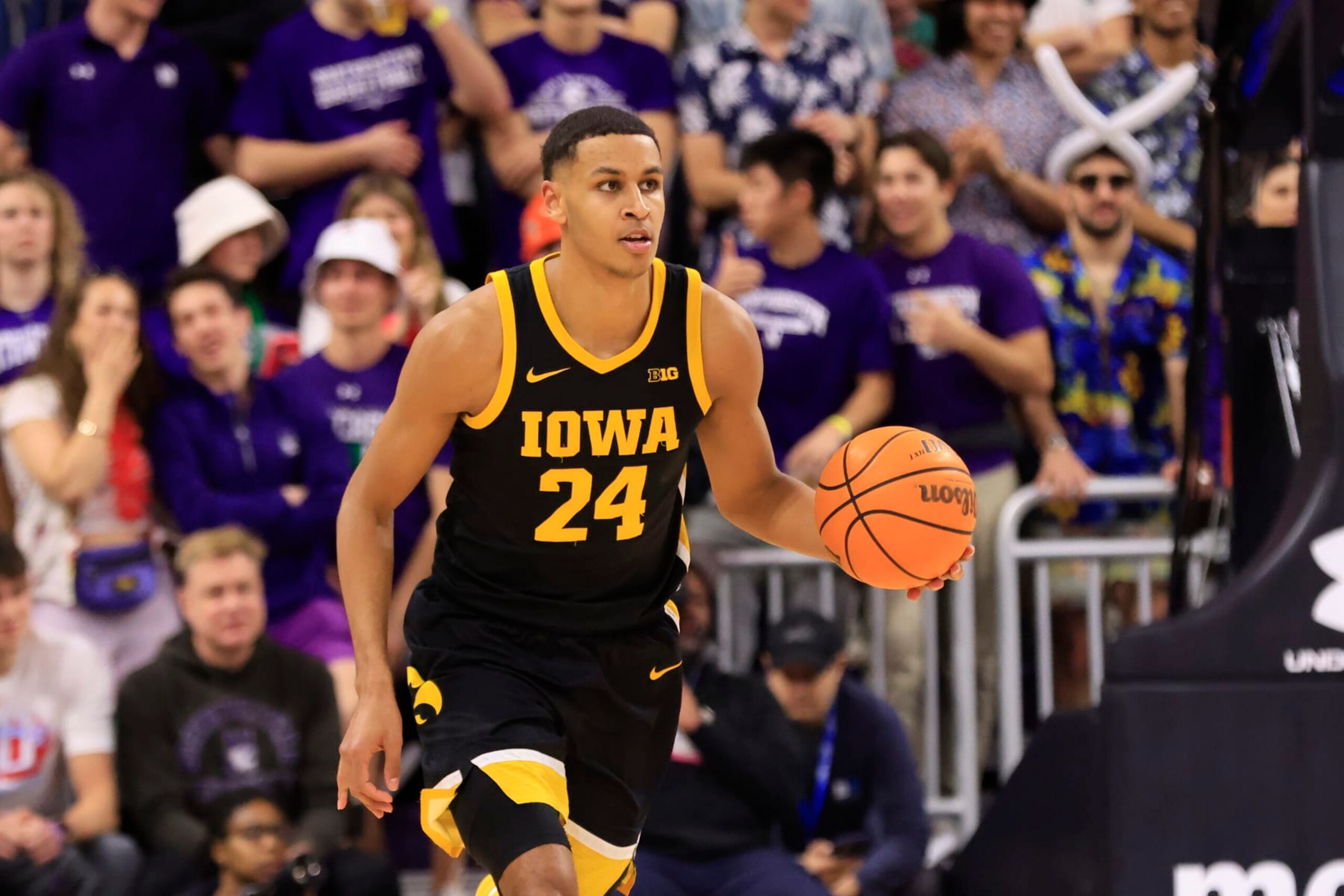 EVANSTON, ILLINOIS - FEBRUARY 19: Kris Murray #24 of the Iowa Hawkeyes brings the ball up the court in the game against the Northwestern Wildcats at Welsh-Ryan Arena on February 19, 2023 in Evanston, Illinois. (Photo by Justin Casterline/Getty Images)