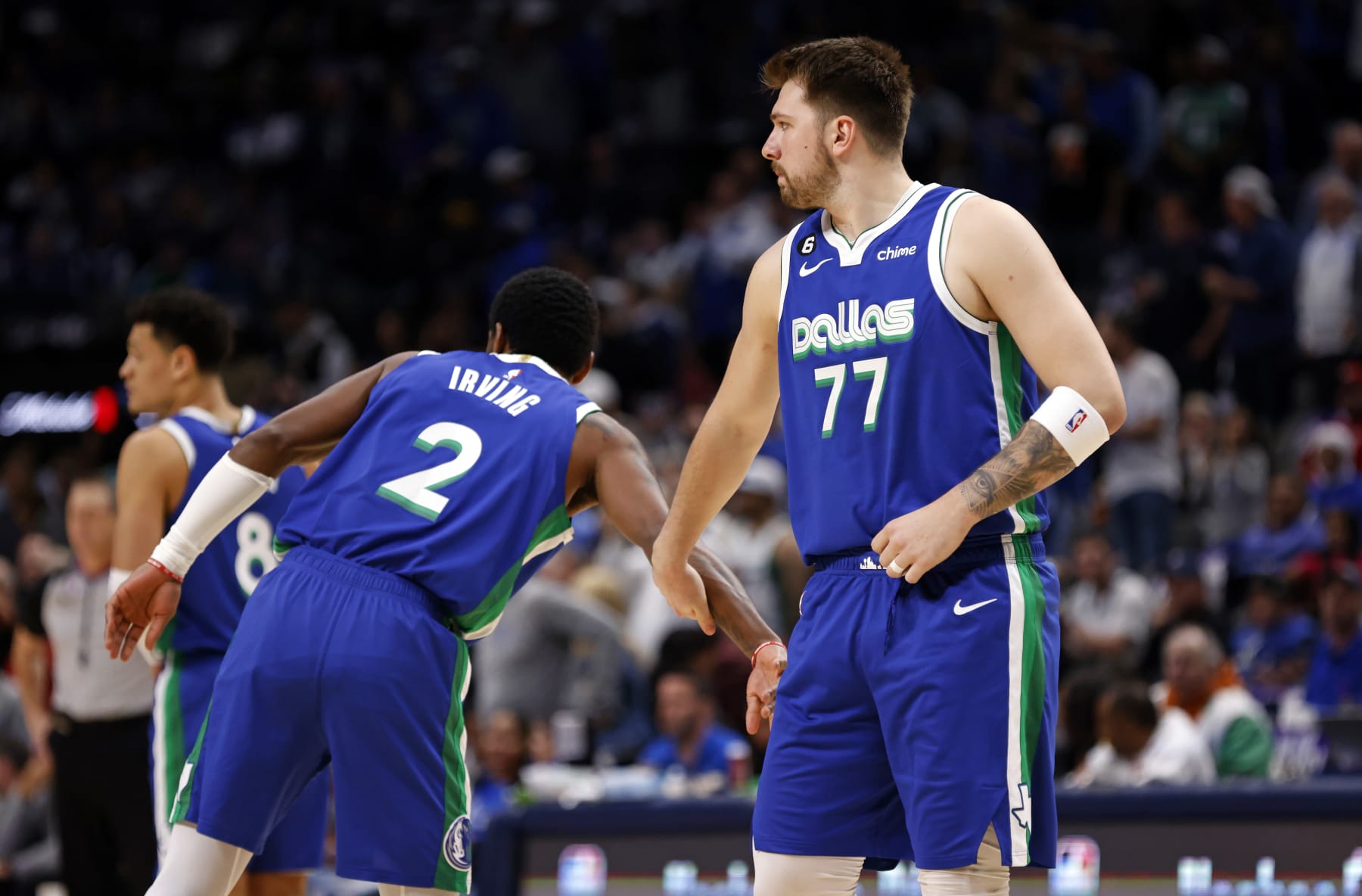 DALLAS, TX - MARCH 2:  Kyrie Irving #2 and Luka Doncic #77 of the Dallas Mavericks celebrate a basket against the Philadelphia 76ers in the first half at American Airlines Center on March 2, 2023 in Dallas, Texas. NOTE TO USER: User expressly acknowledges and agrees that, by downloading and or using this photograph, User is consenting to the terms and conditions of the Getty Images License Agreement. (Photo by Ron Jenkins/Getty Images)