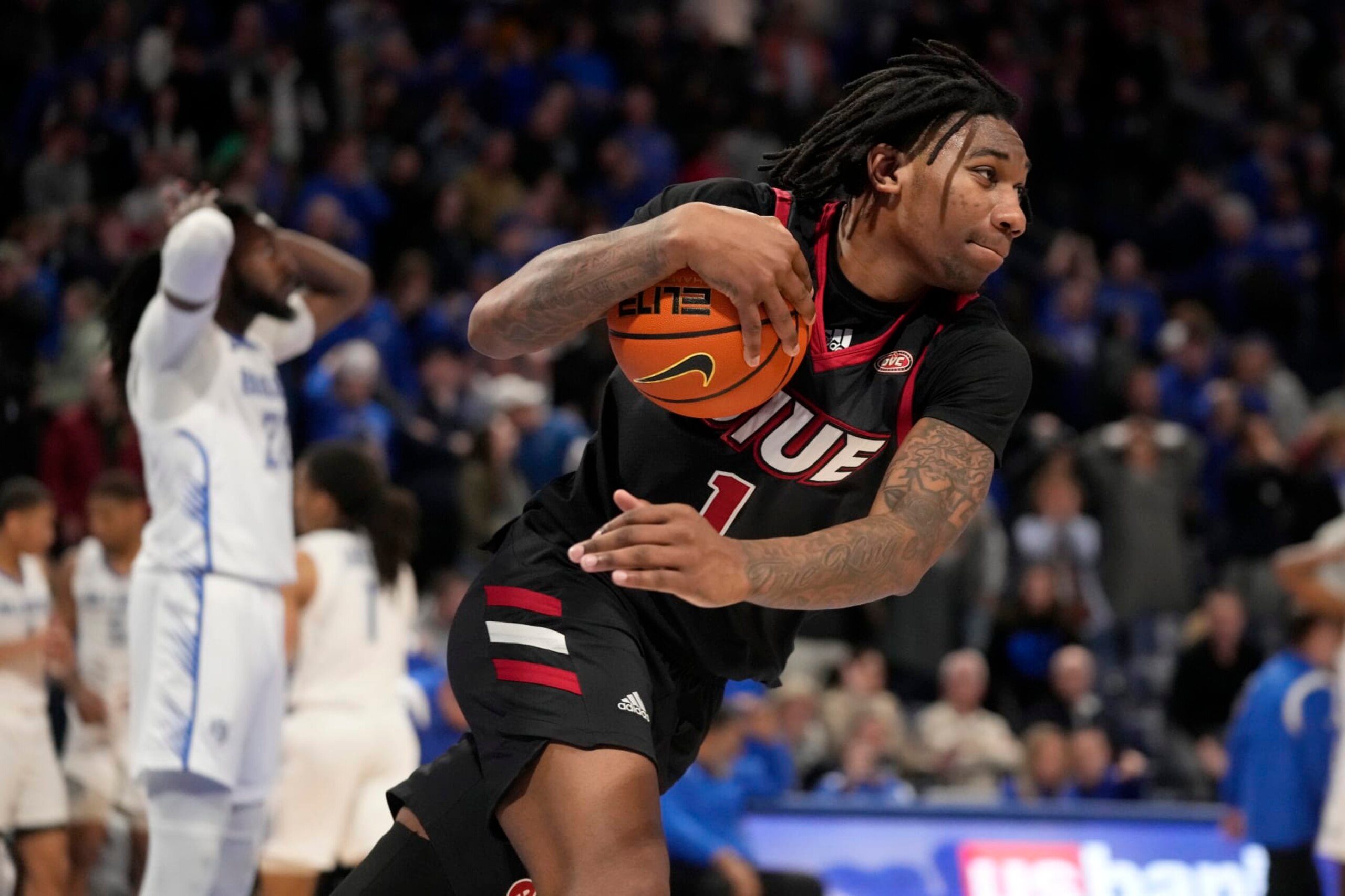 SIU-Edwardsville's DeeJuan Pruitt (1) celebrates after defeating Saint Louis 69-67 following an NCAA college basketball game Wednesday, Dec. 21, 2022, in St. Louis. (AP Photo/Jeff Roberson)
