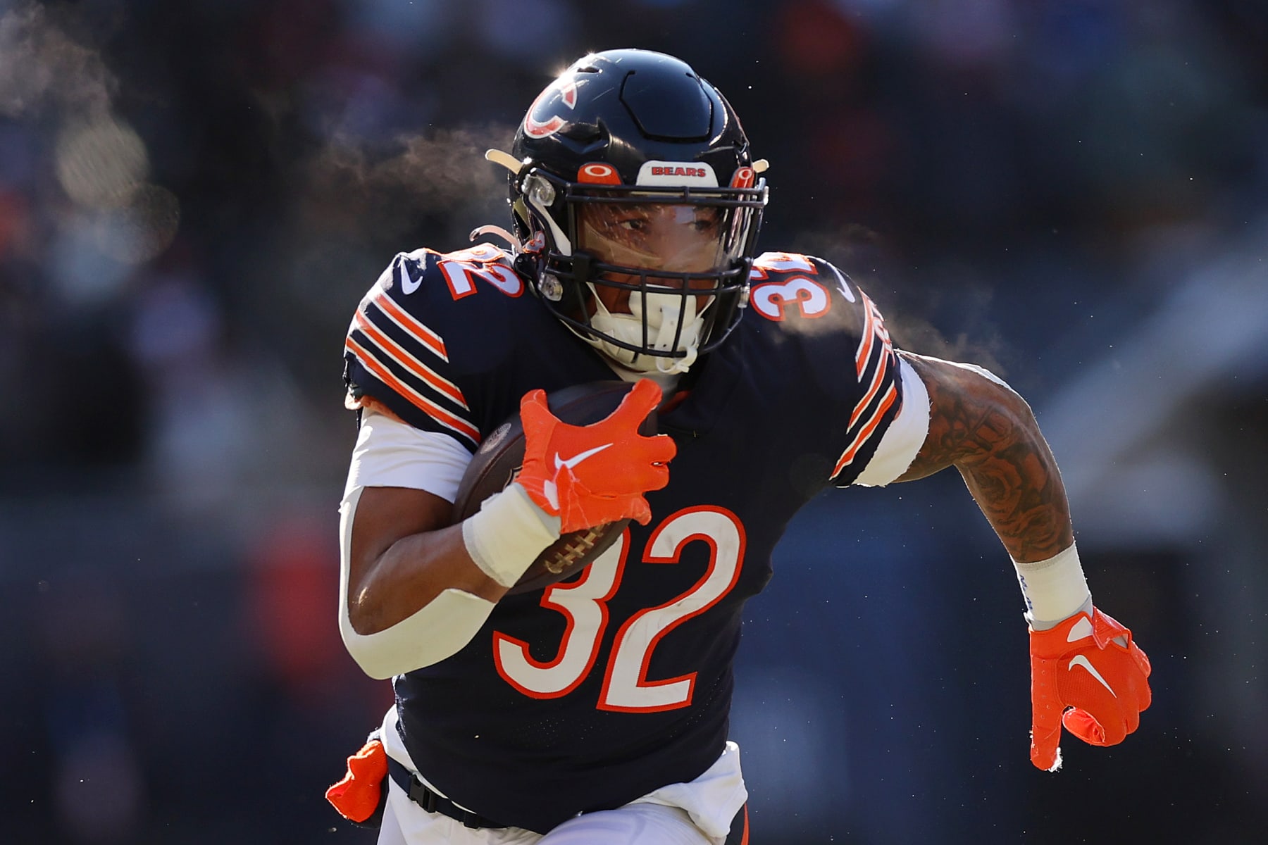 CHICAGO, ILLINOIS - DECEMBER 24: David Montgomery #32 of the Chicago Bears runs with the ball against the Buffalo Bills at Soldier Field on December 24, 2022 in Chicago, Illinois. (Photo by Michael Reaves/Getty Images)
