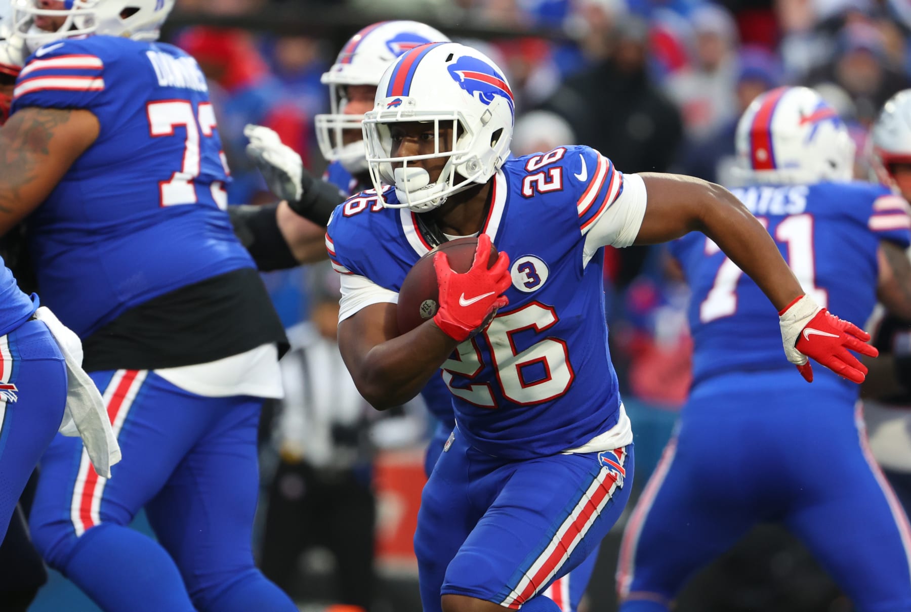 ORCHARD PARK, NY - JANUARY 08: Devin Singletary #26 of the Buffalo Bills runs the ball against the New England Patriots at Highmark Stadium on January 8, 2023 in Orchard Park, New York. (Photo by Timothy T Ludwig/Getty Images)