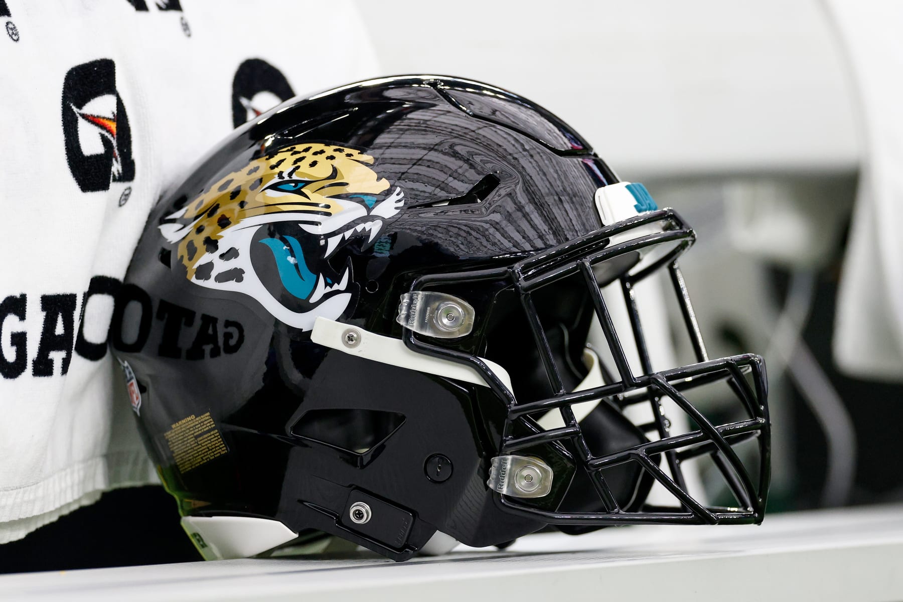 HOUSTON, TEXAS - JANUARY 01: A Jacksonville Jaguars helmet is seen on the bench during the game against the Houston Texans at NRG Stadium on January 01, 2023 in Houston, Texas. (Photo by Tim Warner/Getty Images)
