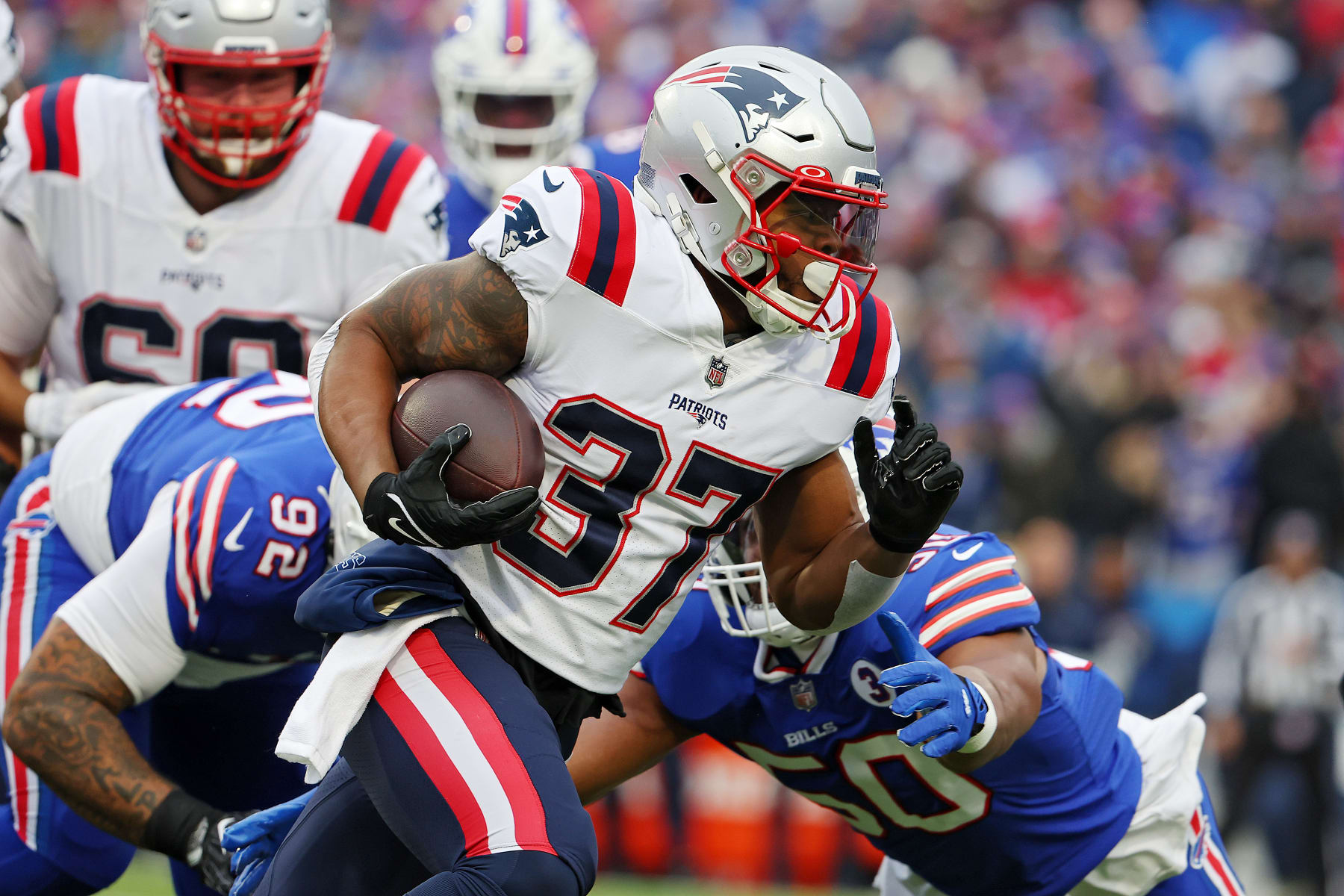 ORCHARD PARK, NEW YORK - JANUARY 08: Damien Harris #37 of the New England Patriots runs the ball during the first quarter against the Buffalo Bills at Highmark Stadium on January 08, 2023 in Orchard Park, New York. (Photo by Timothy T Ludwig/Getty Images)