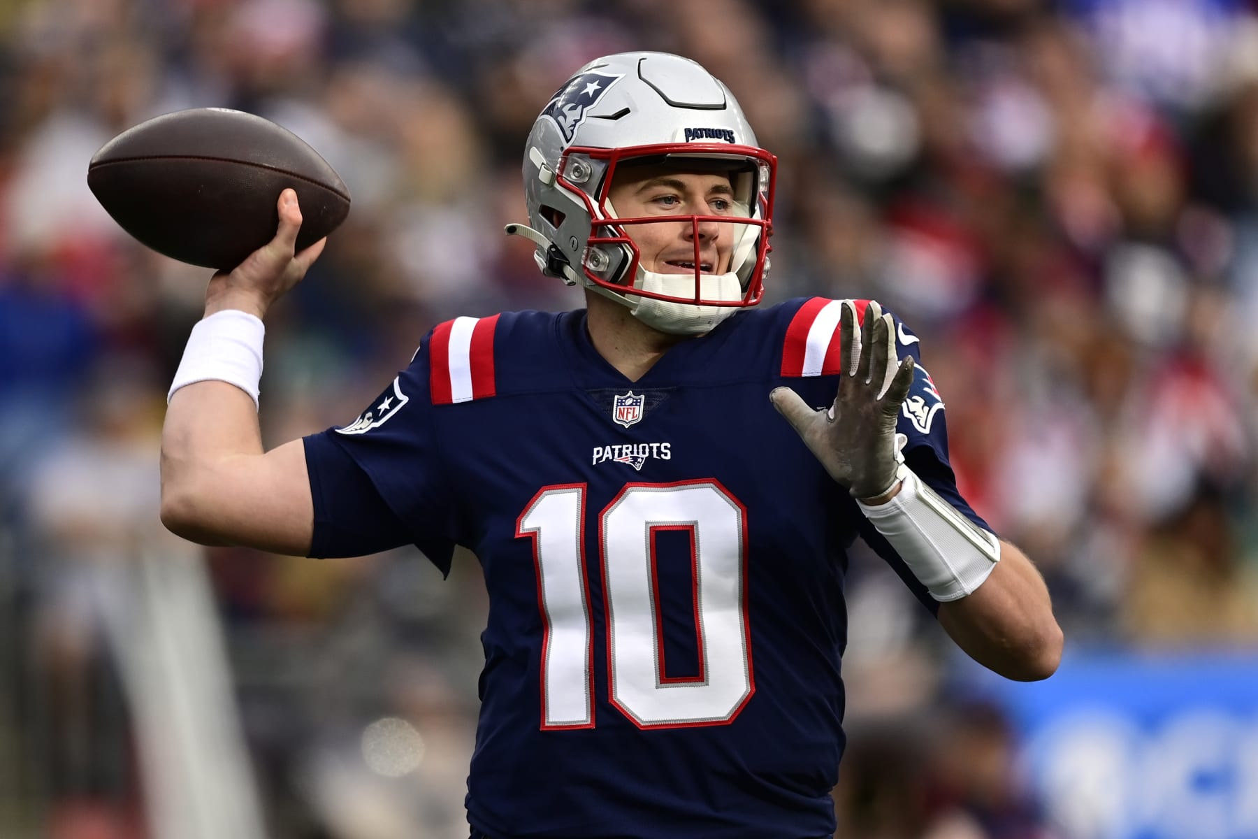 FOXBOROUGH, MASSACHUSETTS - JANUARY 01: Mac Jones #10 of the New England Patriots throws against the Miami Dolphins at Gillette Stadium on January 01, 2023 in Foxborough, Massachusetts. (Photo by Billie Weiss/Getty Images)