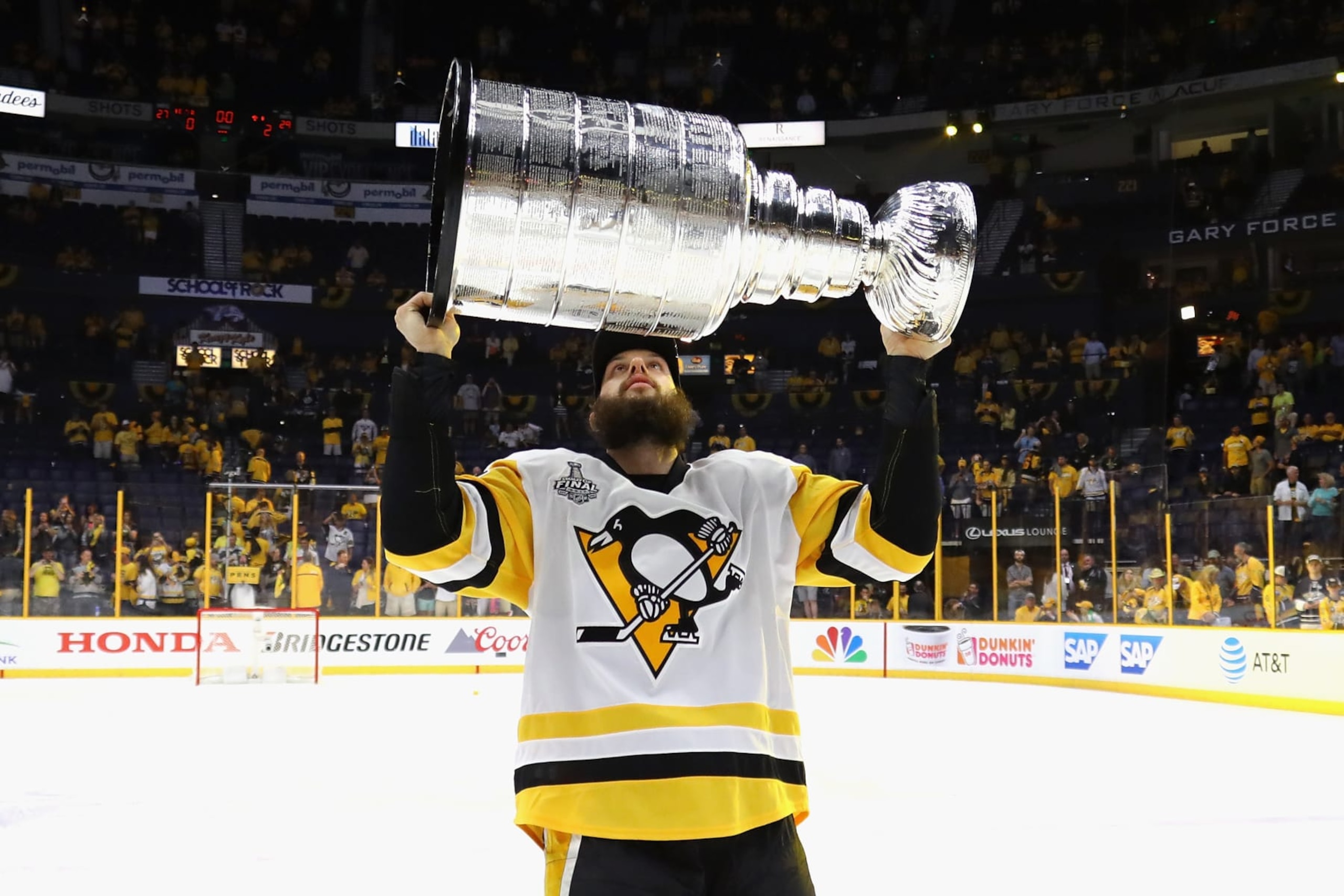 NASHVILLE, TN - JUNE 11:  Nick Bonino #13 of the Pittsburgh Penguins celebrates with the Stanley Cup Trophy after they defeated the Nashville Predators 2-0 in Game Six of the 2017 NHL Stanley Cup Final at the Bridgestone Arena on June 11, 2017 in Nashville, Tennessee.  (Photo by Bruce Bennett/Getty Images)