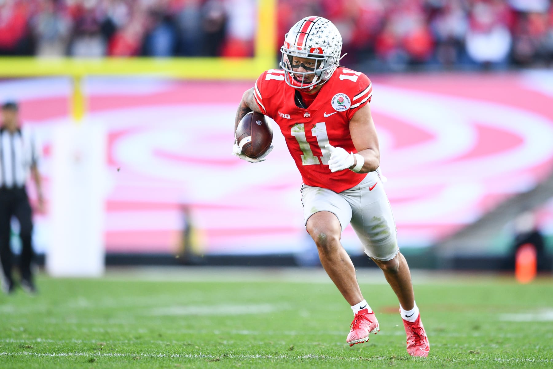 PASADENA, CA - JANUARY 01: Ohio State Buckeyes wide receiver Jaxon Smith-Njigba (11) runs up field during the Rose Bowl game between the Ohio State Buckeyes and the Utah Utes on January 1, 2022 at the Rose Bowl in Pasadena, CA. (Photo by Brian Rothmuller/Icon Sportswire via Getty Images)