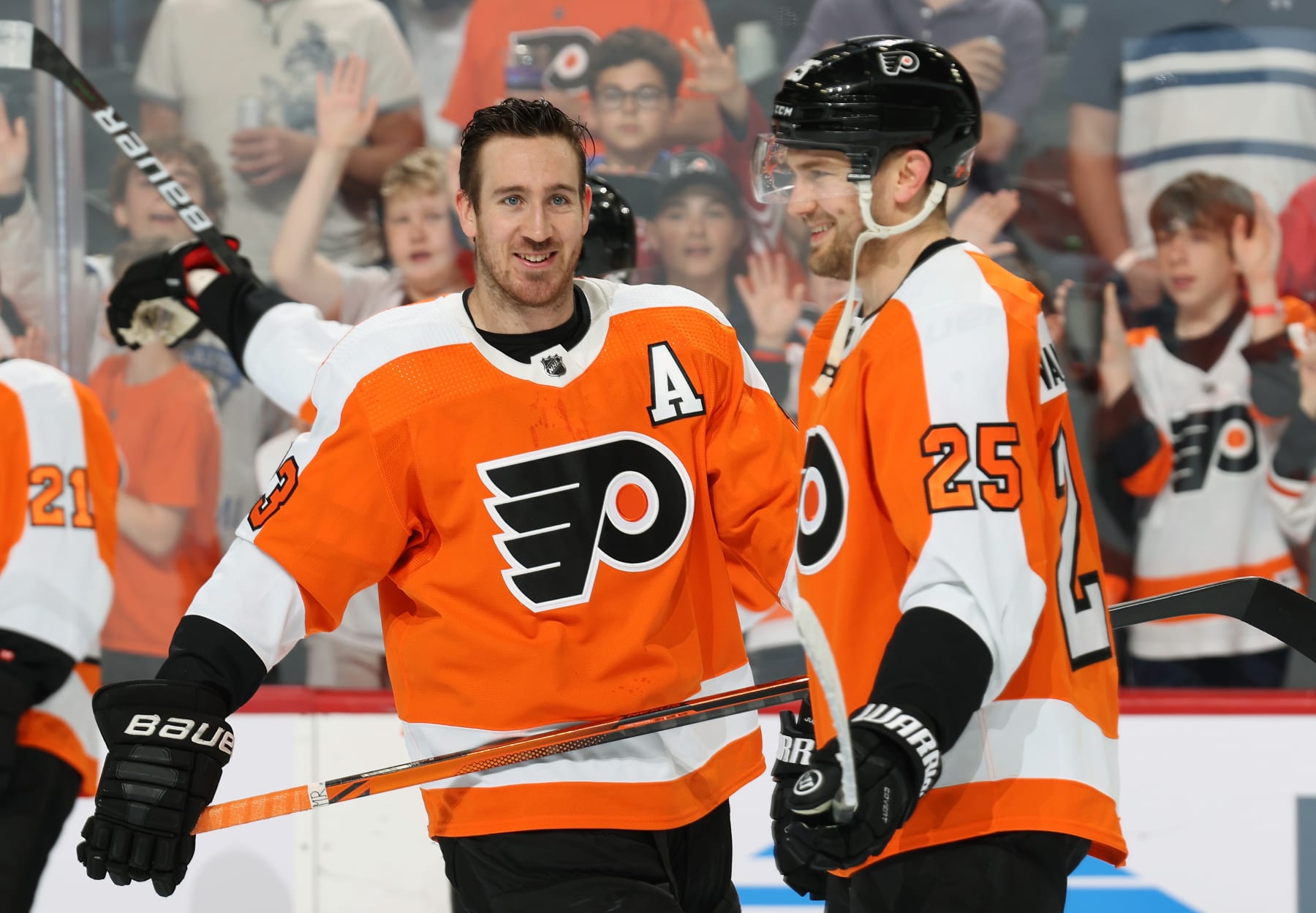 PHILADELPHIA, PA - APRIL 13:  Kevin Hayes #13 and James van Riemsdyk #25 of the Philadelphia Flyers warm-up prior to their game against the New York Rangers at the Wells Fargo Center on April 13, 2022 in Philadelphia, Pennsylvania.  (Photo by Len Redkoles/NHLI via Getty Images)