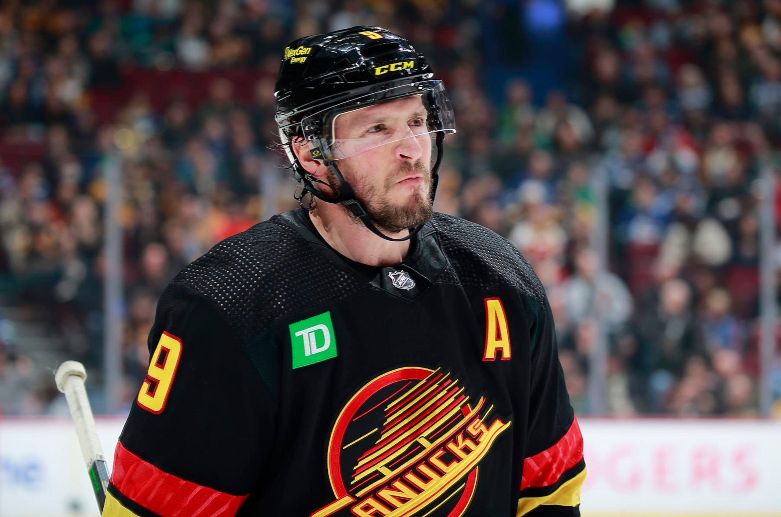 VANCOUVER, CANADA - FEBRUARY 25: J.T. Miller #9 of the Vancouver Canucks skates up ice during their NHL game against the Boston Bruins at Rogers Arena February 25, 2023 in Vancouver, British Columbia, Canada.  (Photo by Jeff Vinnick/NHLI via Getty Images)