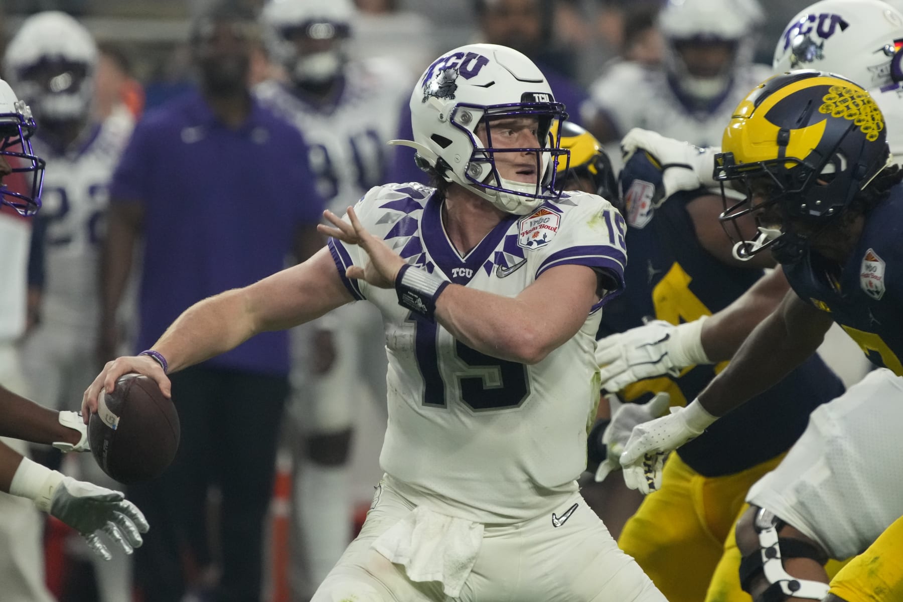 TCU quarterback Max Duggan (15) during the first half of the Fiesta Bowl NCAA college football semifinal playoff game against Michigan, Saturday, Dec. 31, 2022, in Glendale, Arizona. (AP Photo/Rick Scuteri)