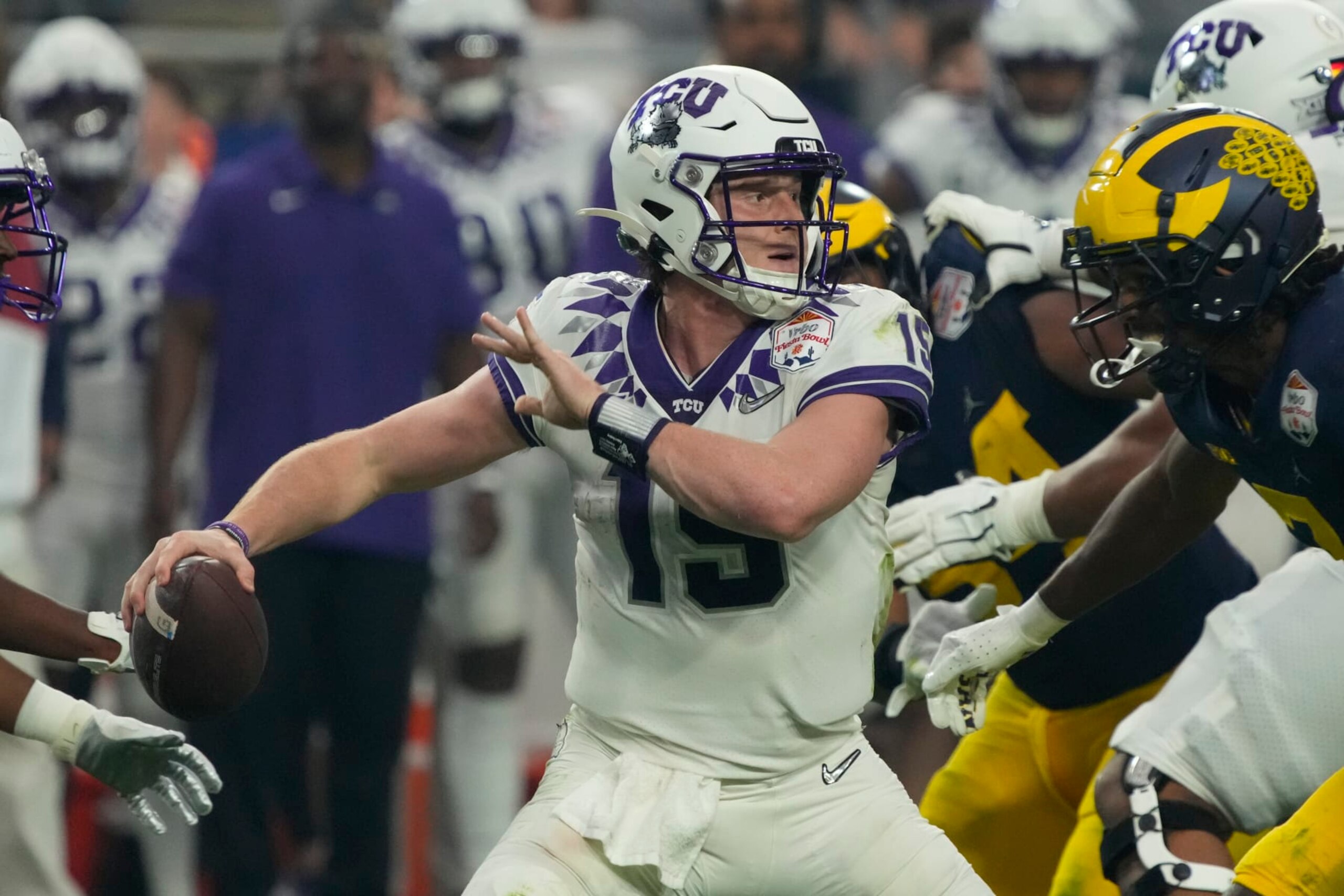 TCU quarterback Max Duggan (15) during the first half of the Fiesta Bowl NCAA college football semifinal playoff game against Michigan, Saturday, Dec. 31, 2022, in Glendale, Arizona. (AP Photo/Rick Scuteri) TCU quarterback Max Duggan (15) during the first half of the Fiesta Bowl NCAA college football semifinal playoff game against Michigan, Saturday, Dec. 31, 2022, in Glendale, Arizona. (AP Photo/Rick Scuteri)