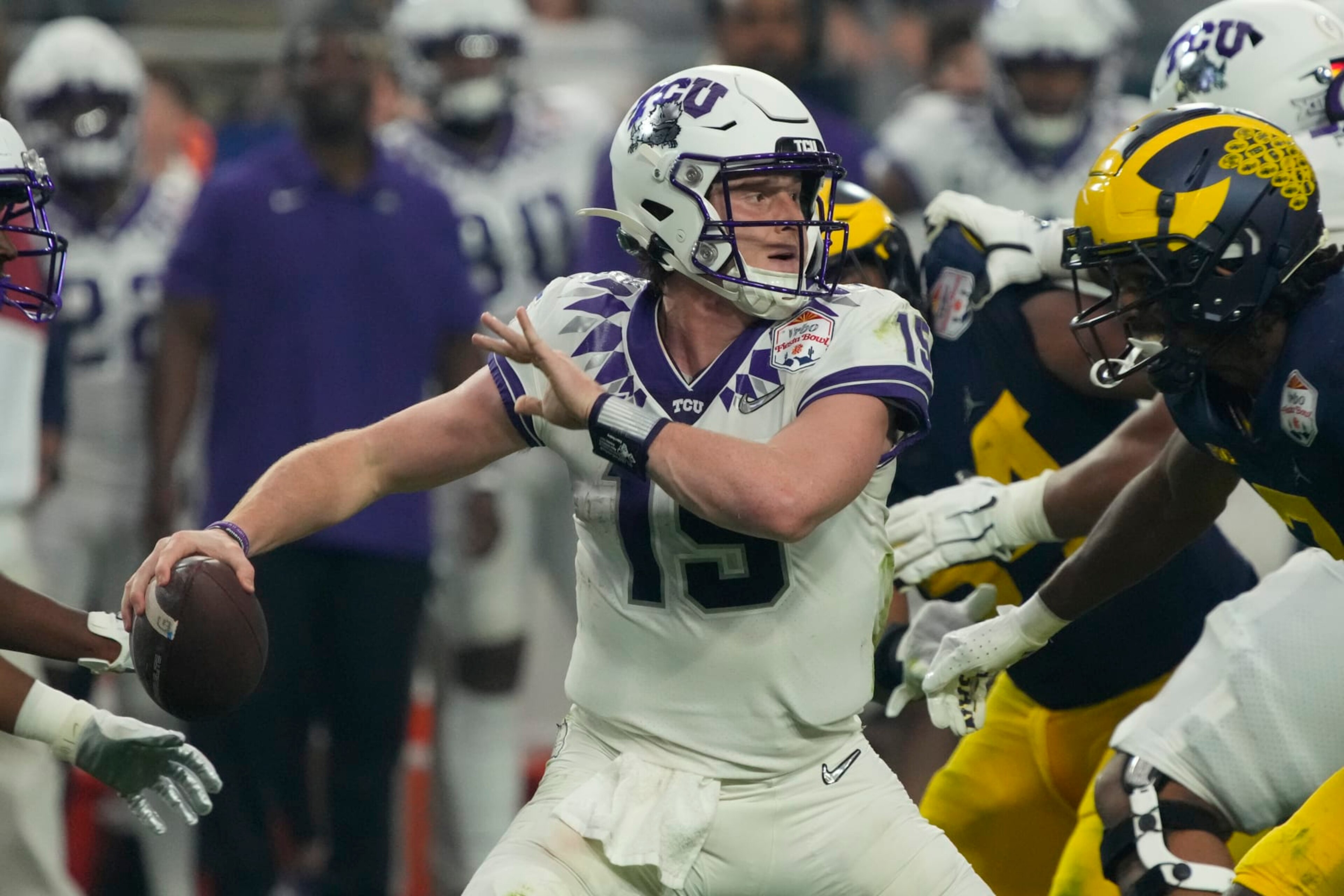 TCU quarterback Max Duggan (15) during the first half of the Fiesta Bowl NCAA college football semifinal playoff game against Michigan, Saturday, Dec. 31, 2022, in Glendale, Arizona. (AP Photo/Rick Scuteri)