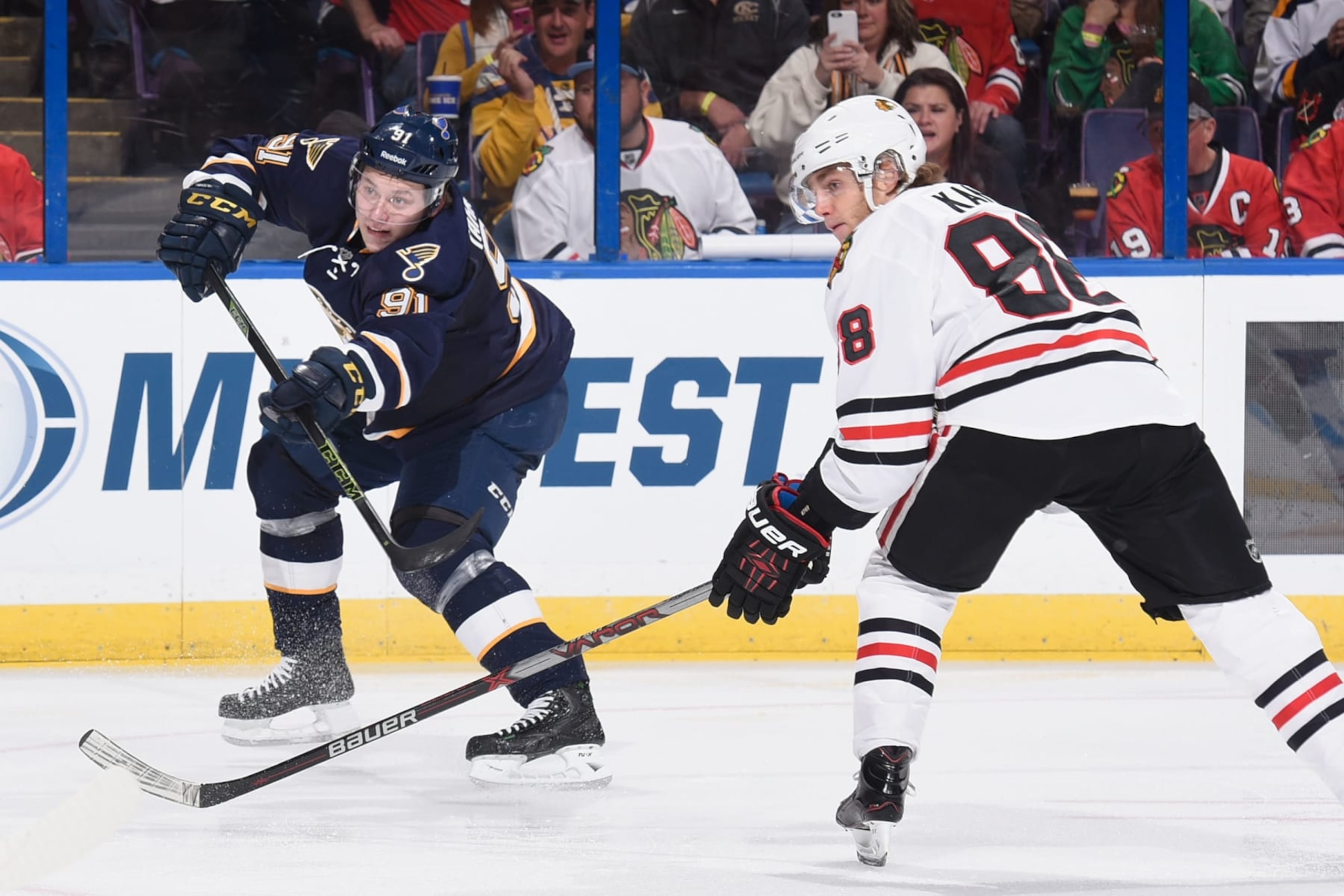 ST. LOUIS, MO - NOVEMBER 14:  Vladimir Tarasenko #91 of the St. Louis Blues takes a shot on goal against Patrick Kane #88 of the Chicago Blackhawks on November 1, 2015 at Scottrade Center in St. Louis, Missouri. (Photo by Scott Rovak/NHLI via Getty Images) 