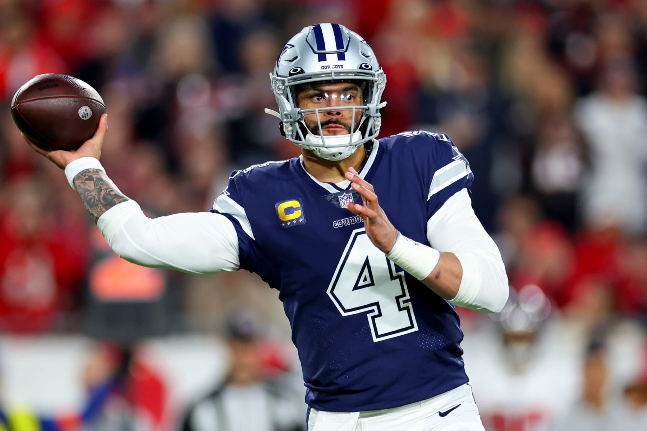 TAMPA, FLORIDA - JANUARY 16: Dak Prescott #4 of the Dallas Cowboys throws a pass against the Tampa Bay Buccaneers during the first quarter of the game in the NFC Wild Card playoff game at Raymond James Stadium on January 16, 2023 in Tampa, Florida. (Photo by Mike Ehrmann/Getty Images)