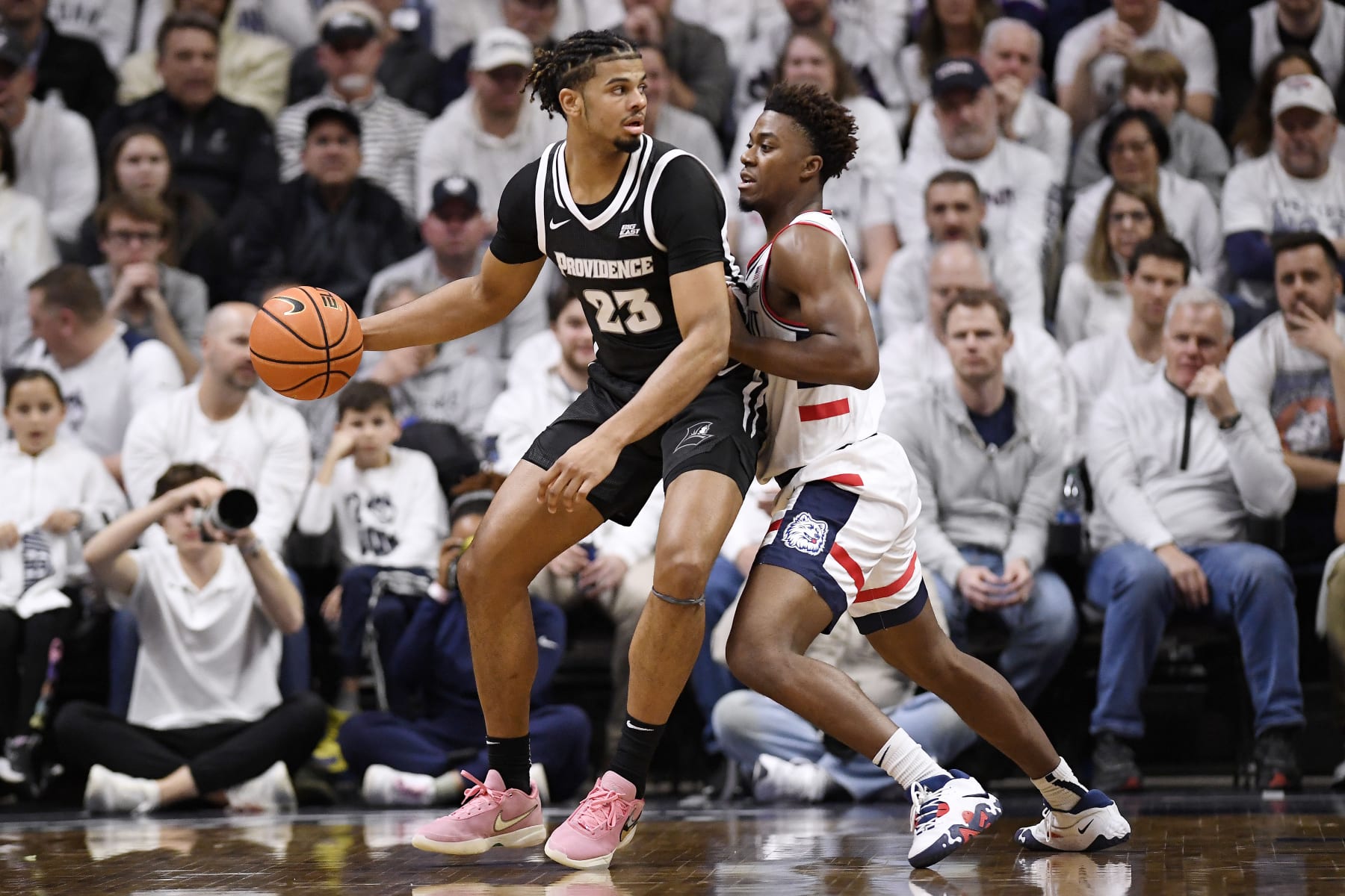 Bryce Hopkins of Providence guarded by Nahiem Alleyne. 