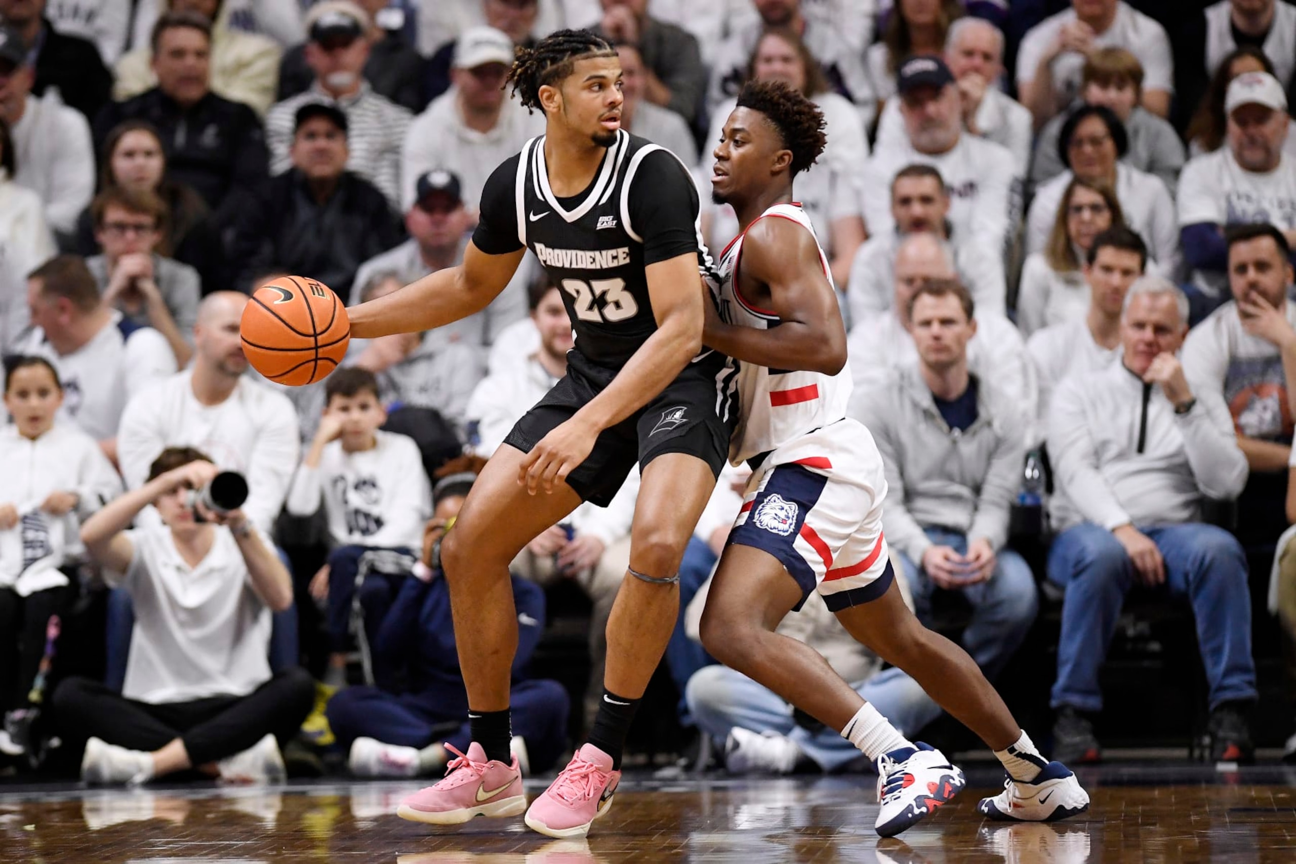 Bryce Hopkins of Providence guarded by Nahiem Alleyne. 