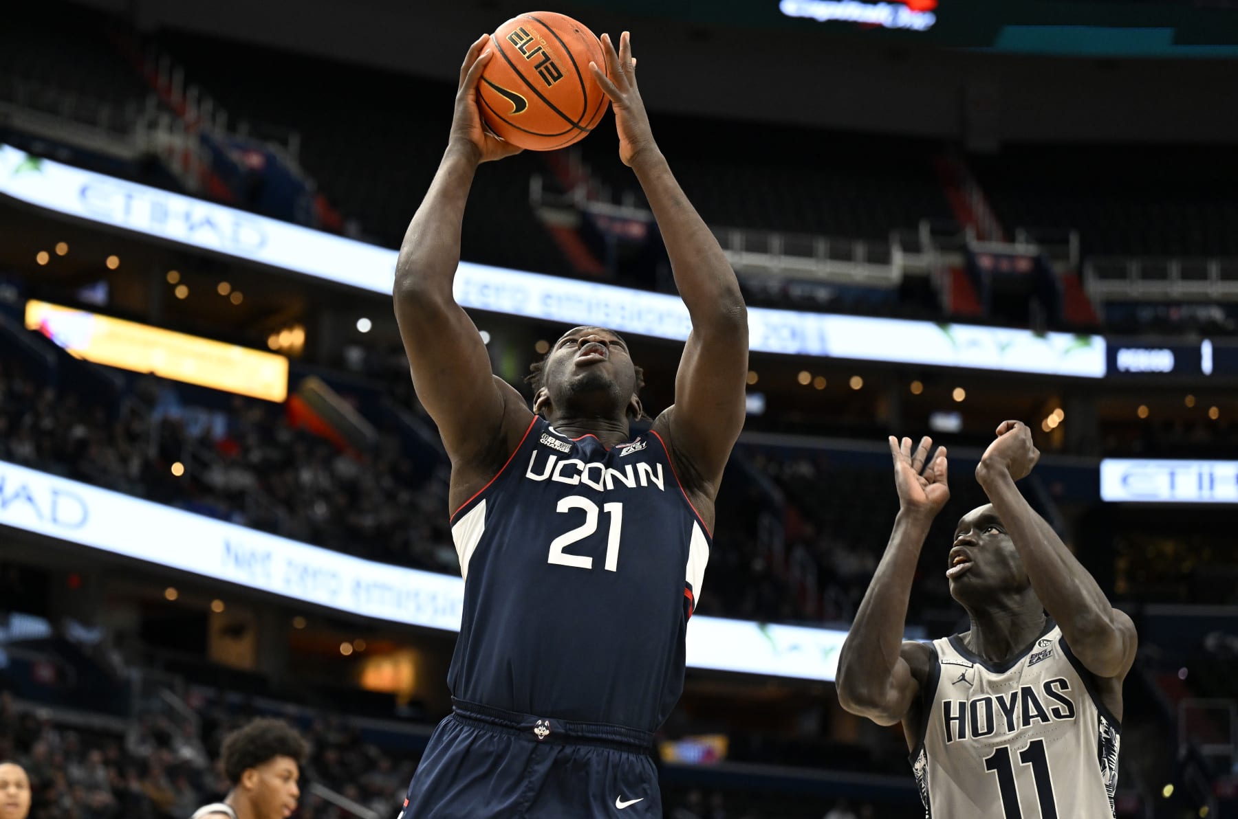 WASHINGTON, DC - FEBRUARY 04: Adama Sanogo #21 of the Connecticut Huskies drives to the basket against the Georgetown Hoyas at Capital One Arena on February 04, 2023 in Washington, DC. (Photo by G Fiume/Getty Images)