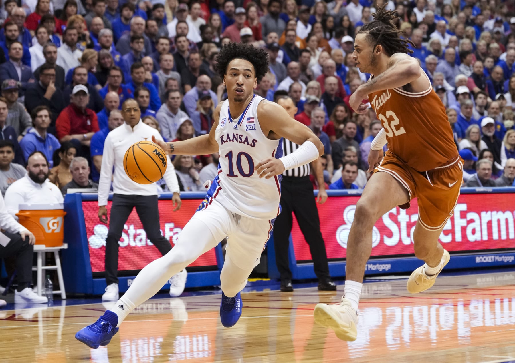 LAWRENCE, KS - FEBRUARY 06: Jalen Wilson #10 of the Kansas Jayhawks drives against Christian Bishop #32 of the Texas Longhorns during the first half at Allen Fieldhouse on February 6, 2023 in Lawrence, Kansas. (Photo by Jay Biggerstaff/Getty Images)