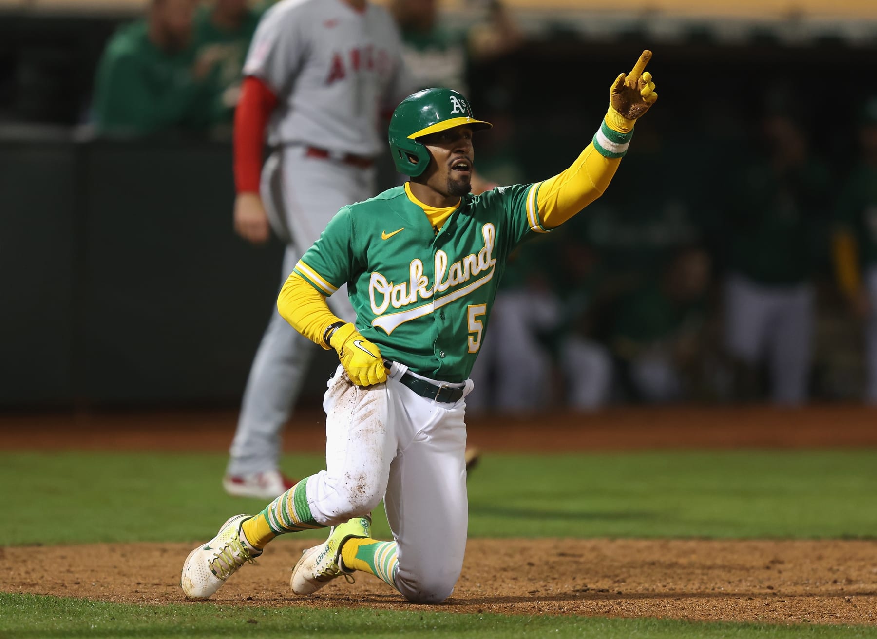 OAKLAND, CALIFORNIA - OCTOBER 04: Tony Kemp #5 of the Oakland Athletics scores on a single by Seth Brown #15 in the bottom of the eighth inning against the Los Angeles Angels at RingCentral Coliseum on October 04, 2022 in Oakland, California. (Photo by Lachlan Cunningham/Getty Images)