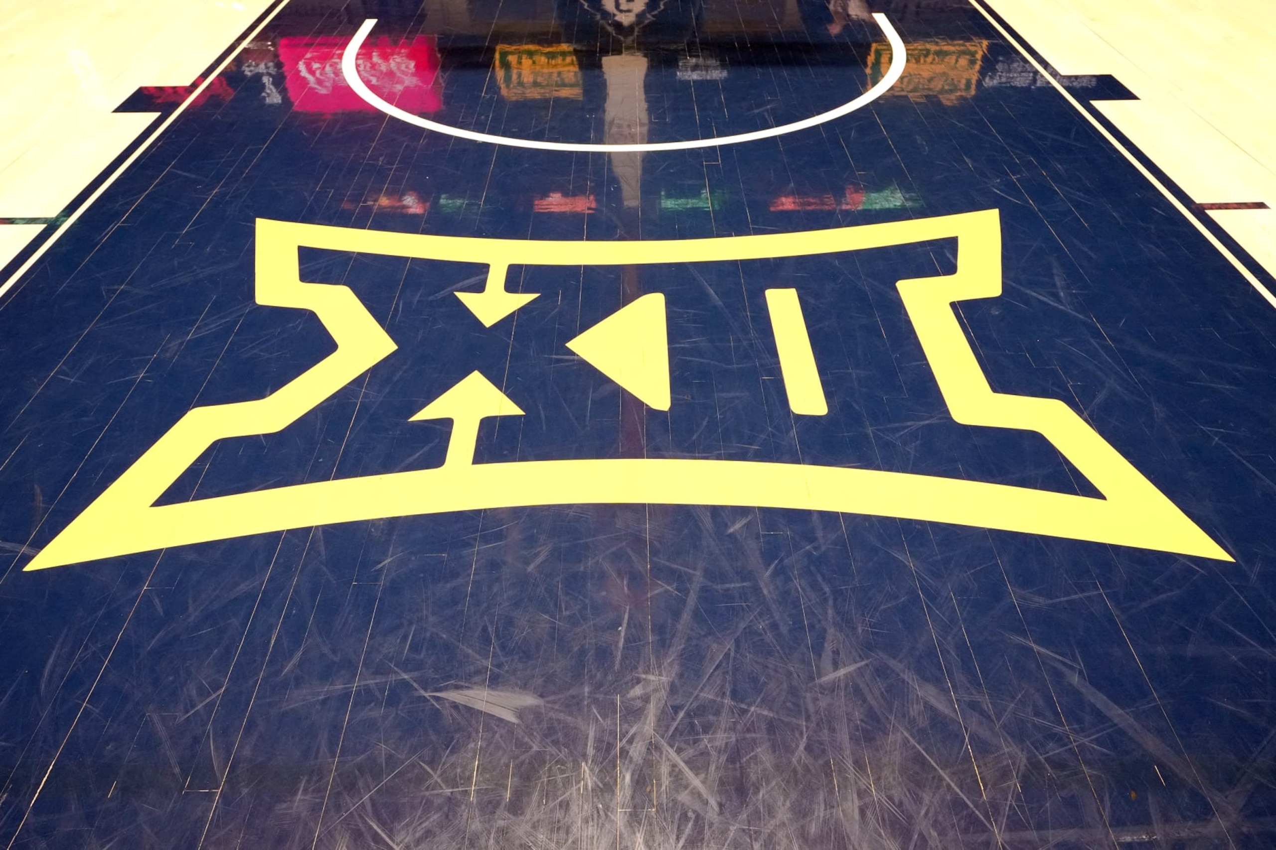 MORGANTOWN, WEST VIRGINIA - FEBRUARY 20:  The Big XII logo is displayed on the floor before a college basketball game between the West Virginia Mountaineers and the Oklahoma State Cowboys at the WVU Coliseum on February 20, 2023 in Morgantown, West Virginia.  (Photo by Mitchell Layton/Getty Images)