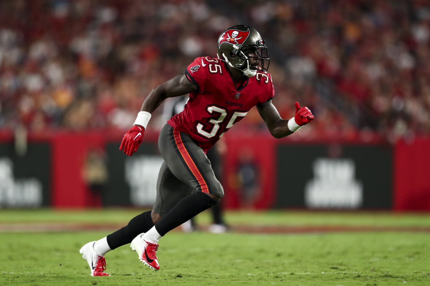 TAMPA, FL - OCTOBER 27: Jamel Dean #35 of the Tampa Bay Buccaneers defends in pass coverage during an NFL football game against the Baltimore Ravens at Raymond James Stadium on October 27, 2022 in Tampa, Florida. (Photo by Kevin Sabitus/Getty Images)