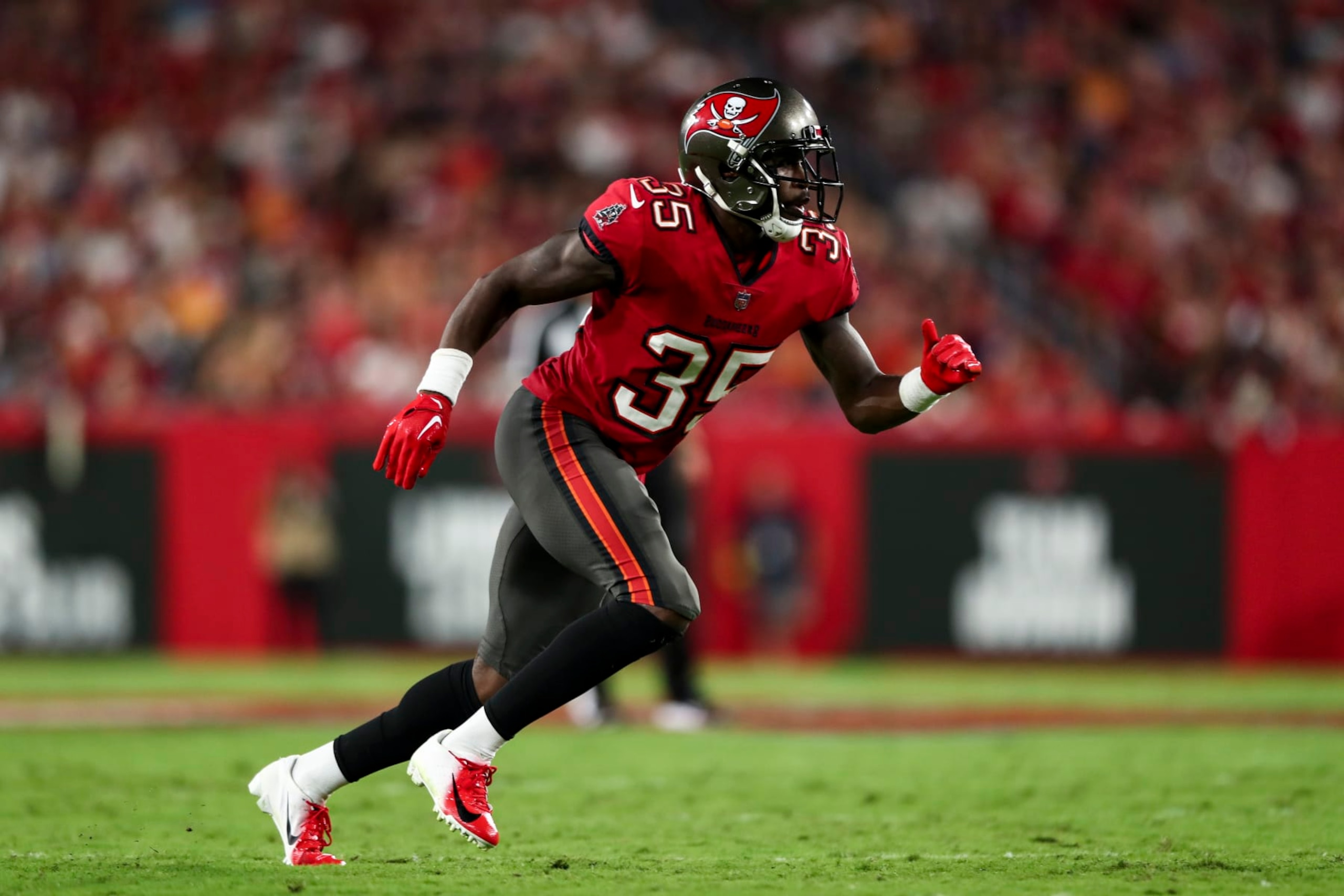 TAMPA, FL - OCTOBER 27: Jamel Dean #35 of the Tampa Bay Buccaneers defends in pass coverage during an NFL football game against the Baltimore Ravens at Raymond James Stadium on October 27, 2022 in Tampa, Florida. (Photo by Kevin Sabitus/Getty Images)