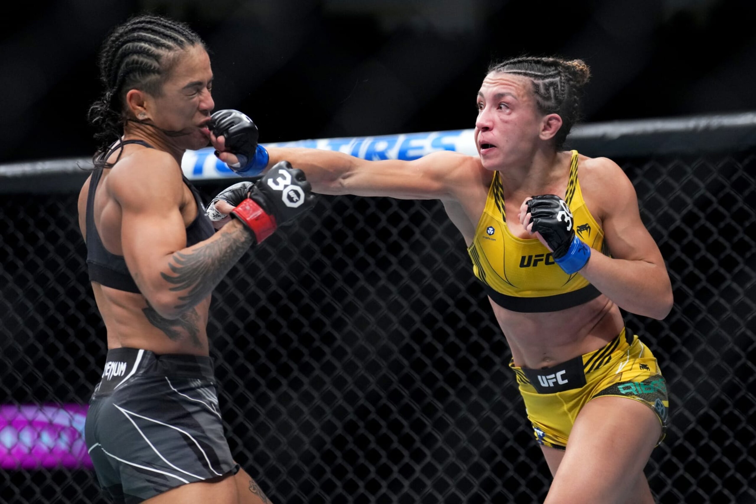 LAS VEGAS, NEVADA - MARCH 04: (R-L) Amanda Ribas of Brazil punches Viviane Araujo of Brazil in a flyweight fight during the UFC 285 event at T-Mobile Arena on March 04, 2023 in Las Vegas, Nevada. (Photo by Chris Unger/Zuffa LLC via Getty Images)