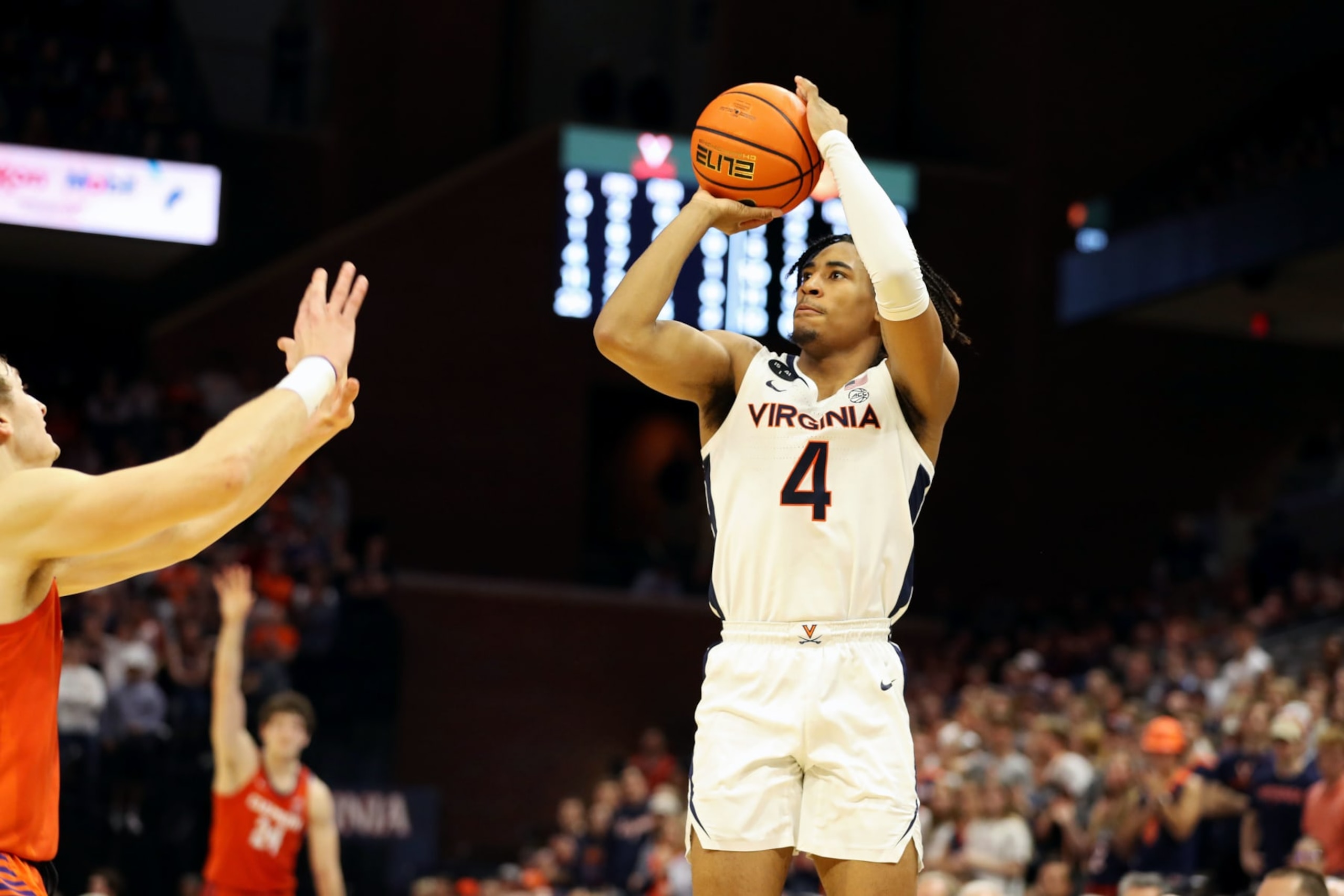 CHARLOTTESVILLE, VA - FEBRUARY 28: Armaan Franklin #4 of the Virginia Cavaliers shoots over Hunter Tyson #5 of the Clemson Tigers in the second half during a game at John Paul Jones Arena on February 28, 2023 in Charlottesville, Virginia. (Photo by Ryan M. Kelly/Getty Images)