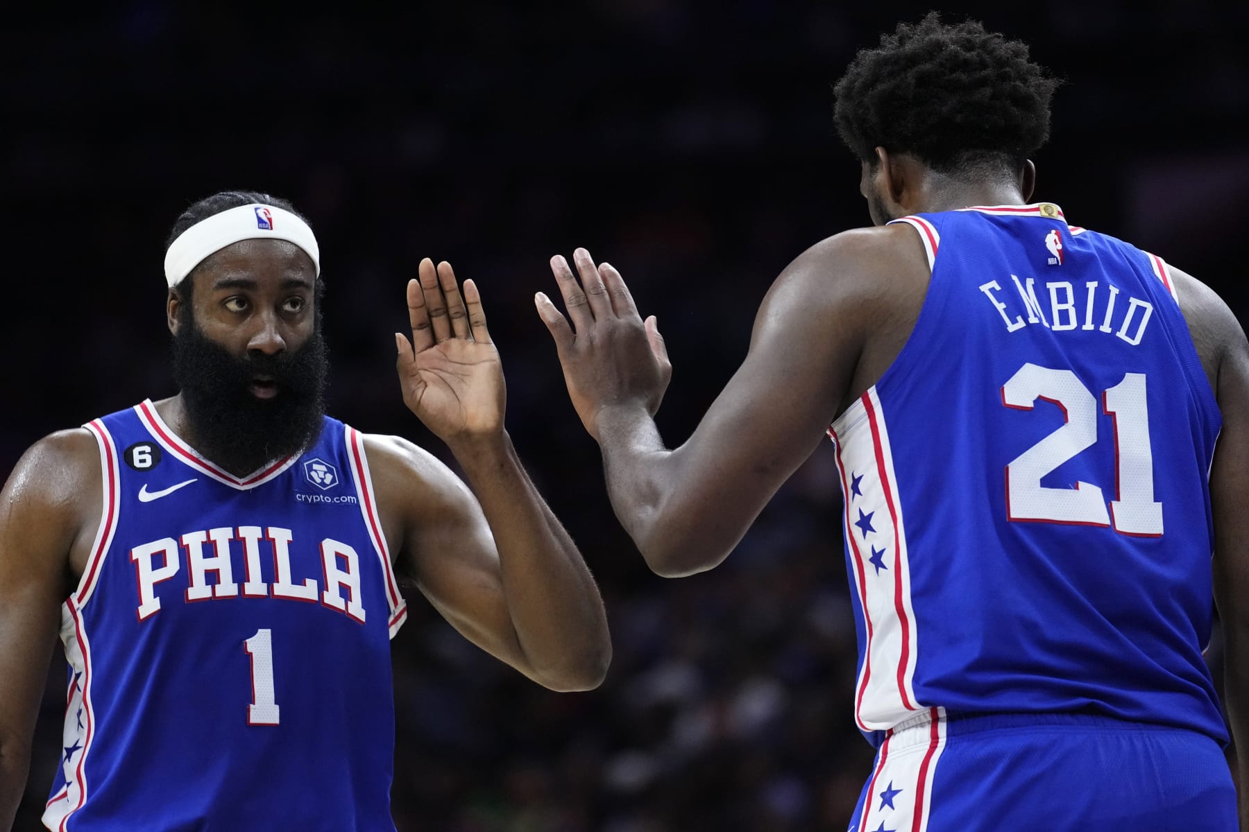 Philadelphia 76ers' James Harden, left, and Joel Embiid react during the second half of an NBA basketball game against the Memphis Grizzlies, Thursday, Feb. 23, 2023, in Philadelphia. (AP Photo/Matt Slocum)