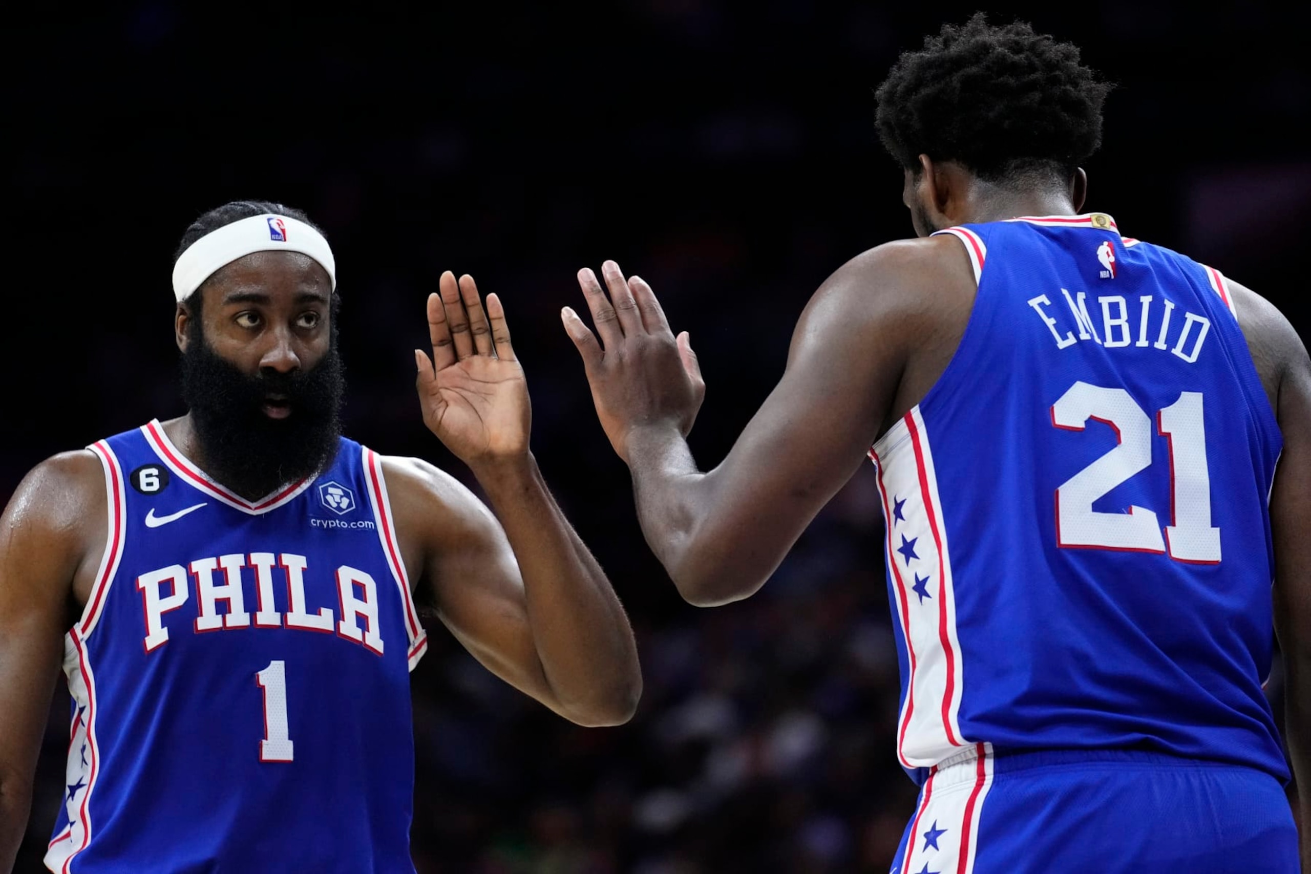 Philadelphia 76ers' James Harden, left, and Joel Embiid react during the second half of an NBA basketball game against the Memphis Grizzlies, Thursday, Feb. 23, 2023, in Philadelphia. (AP Photo/Matt Slocum)