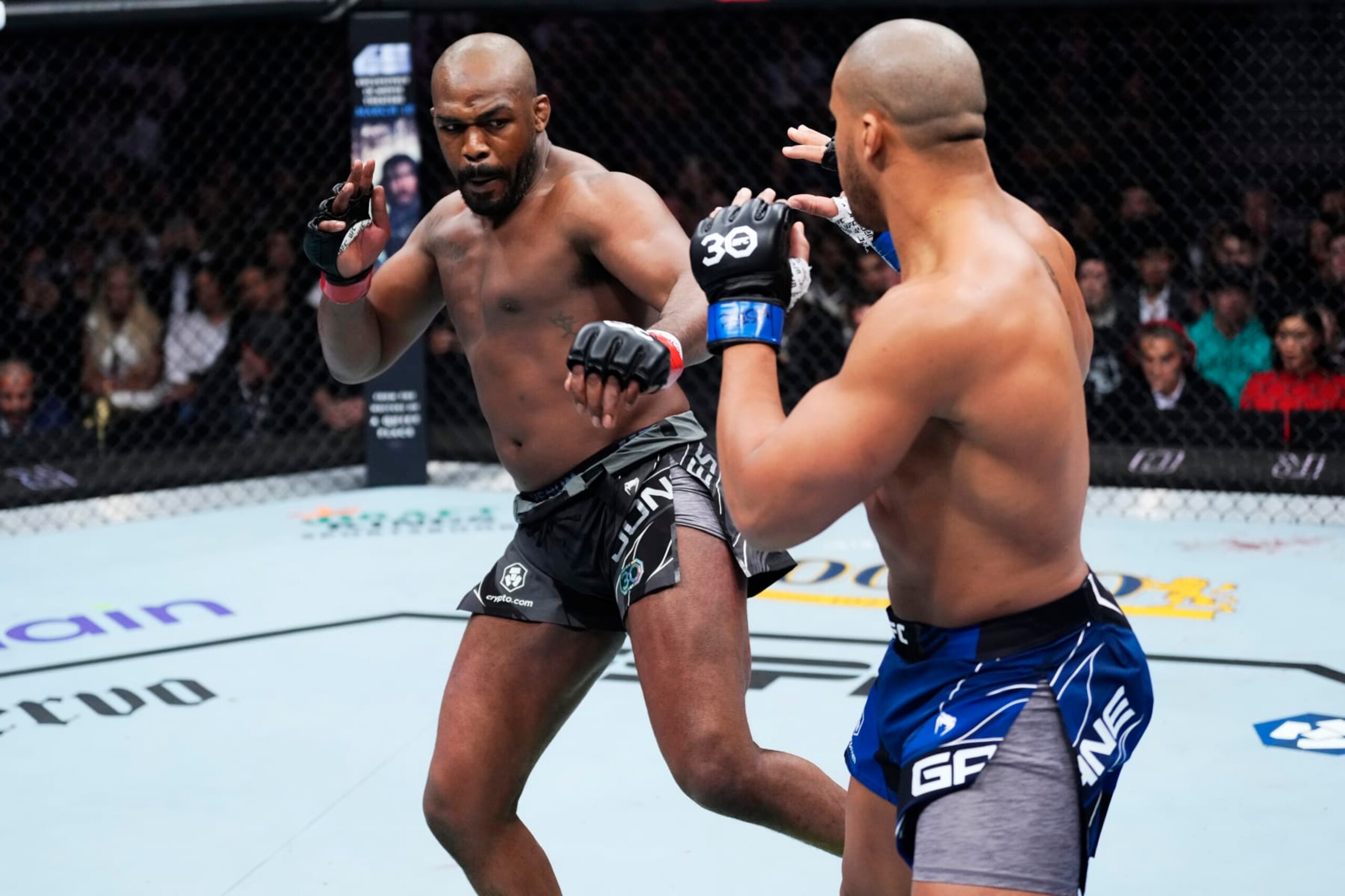 LAS VEGAS, NEVADA - MARCH 04: (L-R) Jon Jones kicks Ciryl Gane of France in the UFC heavyweight championship fight during the UFC 285 event at T-Mobile Arena on March 04, 2023 in Las Vegas, Nevada. (Photo by Jeff Bottari/Zuffa LLC via Getty Images)