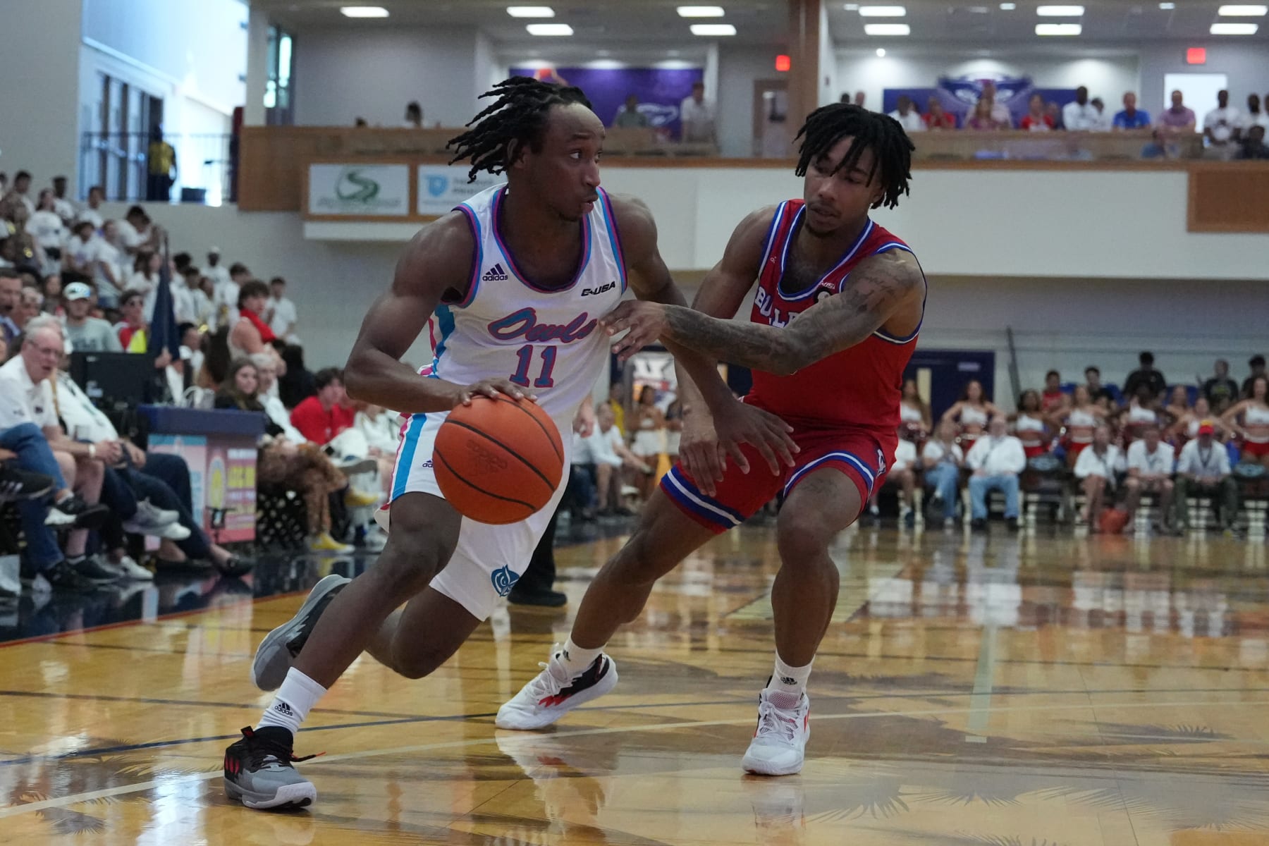 BOCA RATON, FL - FEBRUARY 11: Florida Atlantic Owls guard Michael Forrest (11) drives to the basket as Louisiana Tech Bulldogs guard Quandre Bullock (3) defends during the game between the Louisiana Tech Bulldogs and the Florida Atlantic (FAU) Owls on Saturday, February 11, 2023 at FAU Arena in Boca Raton, Fla. (Photo by Peter Joneleit/Icon Sportswire via Getty Images)
