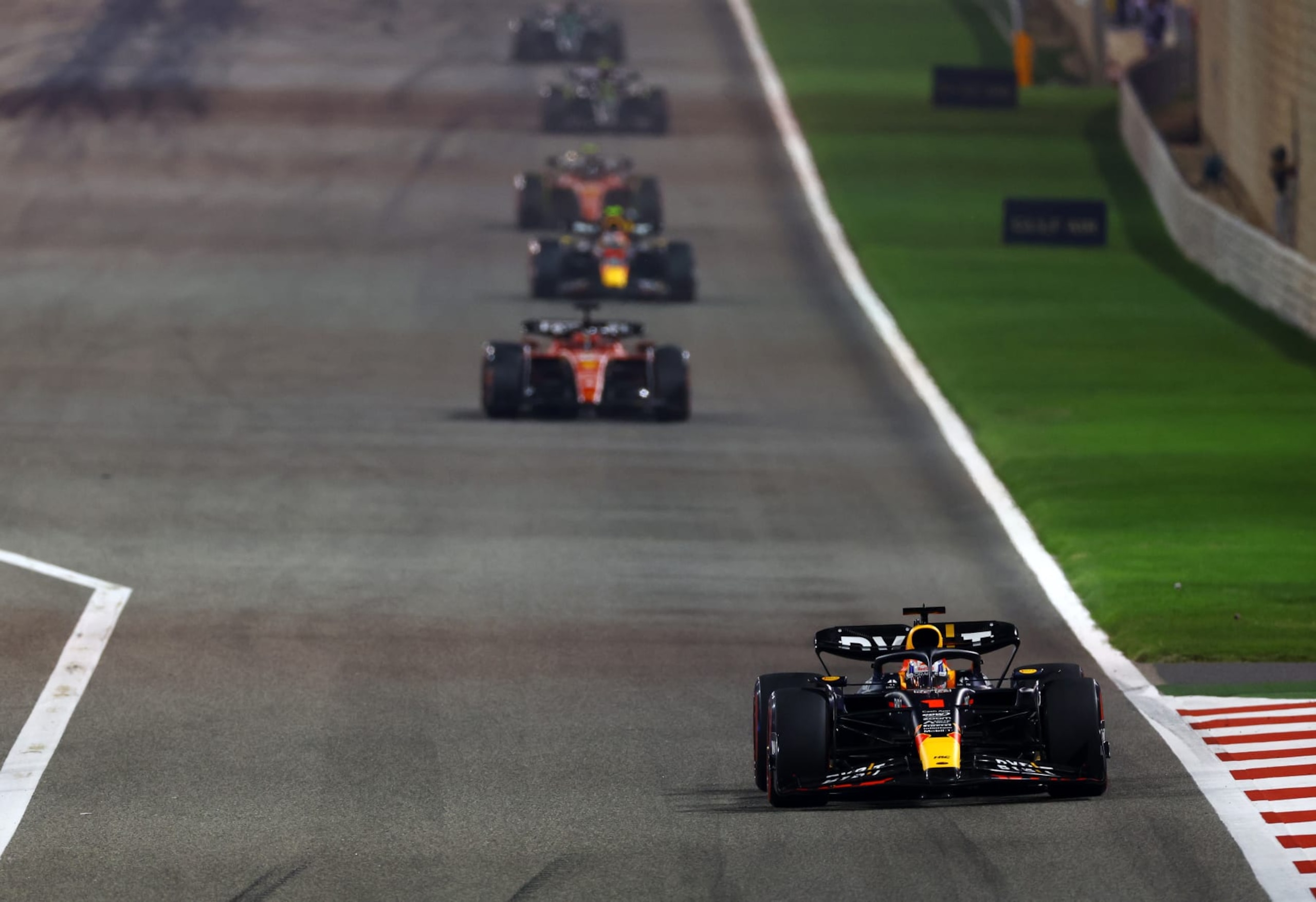 BAHRAIN, BAHRAIN - MARCH 05: Max Verstappen of the Netherlands driving the (1) Oracle Red Bull Racing RB19 leads Charles Leclerc of Monaco driving the (16) Ferrari SF-23 during the F1 Grand Prix of Bahrain at Bahrain International Circuit on March 05, 2023 in Bahrain, Bahrain. (Photo by Mark Thompson/Getty Images)