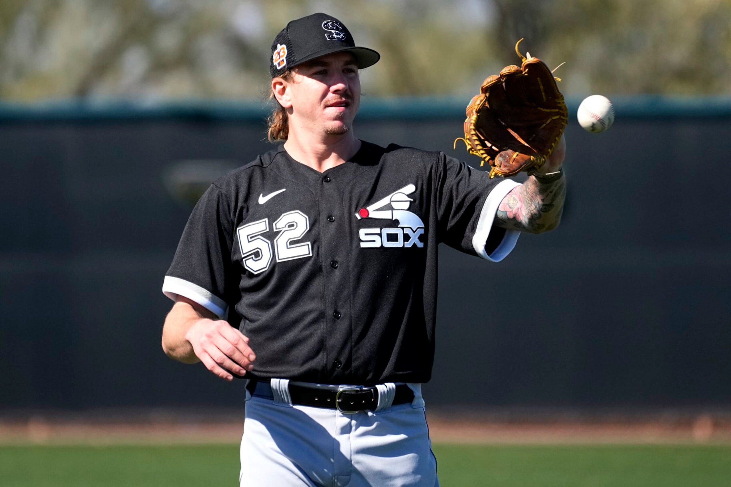 Chicago White Sox starting pitcher Mike Clevinger (52) works out during a spring training baseball practice, Wednesday, Feb. 15, 2023, in Phoenix. (AP Photo/Matt York) Chicago White Sox starting pitcher Mike Clevinger (52) works out during a spring training baseball practice, Wednesday, Feb. 15, 2023, in Phoenix. (AP Photo/Matt York)