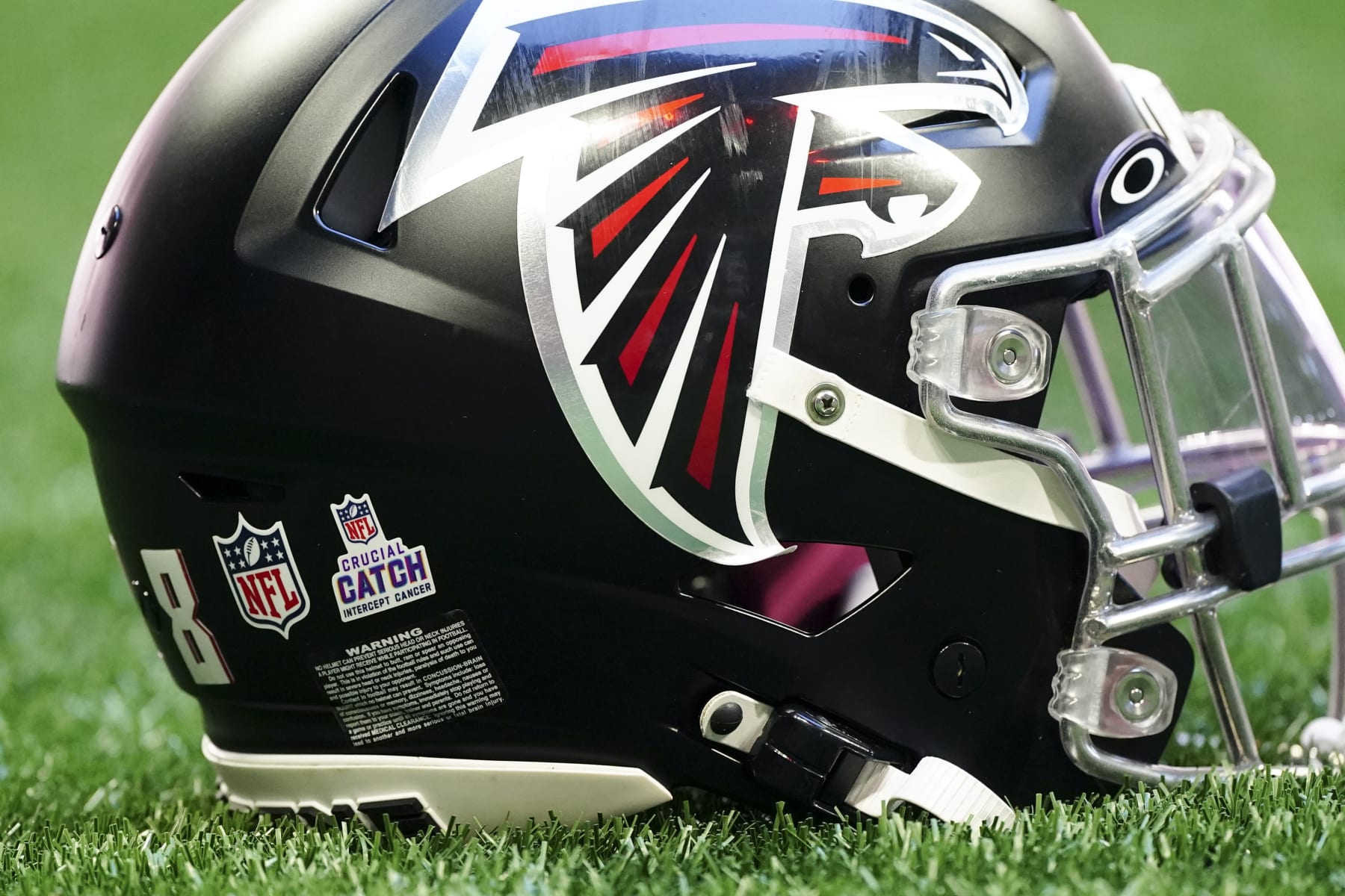 The logo for the NFL's Cancer Prevention initiative "Critical Catch" is shown on the helmet of an Atlanta Falcon before an NFL football game against the Cleveland Browns Sunday, Oct. 2, 2022, in Atlanta. (AP Photo/John Bazemore)