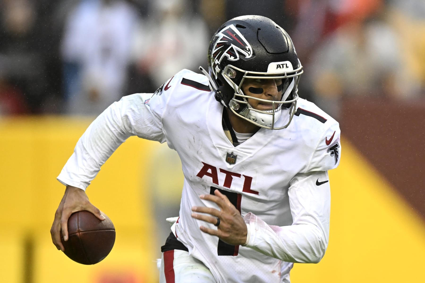 LANDOVER, MARYLAND - NOVEMBER 27: Marcus Mariota #1 of the Atlanta Falcons rolls out of the pocket in the fourth quarter of a game against the Washington Commanders at FedExField on November 27, 2022 in Landover, Maryland. (Photo by Greg Fiume/Getty Images)