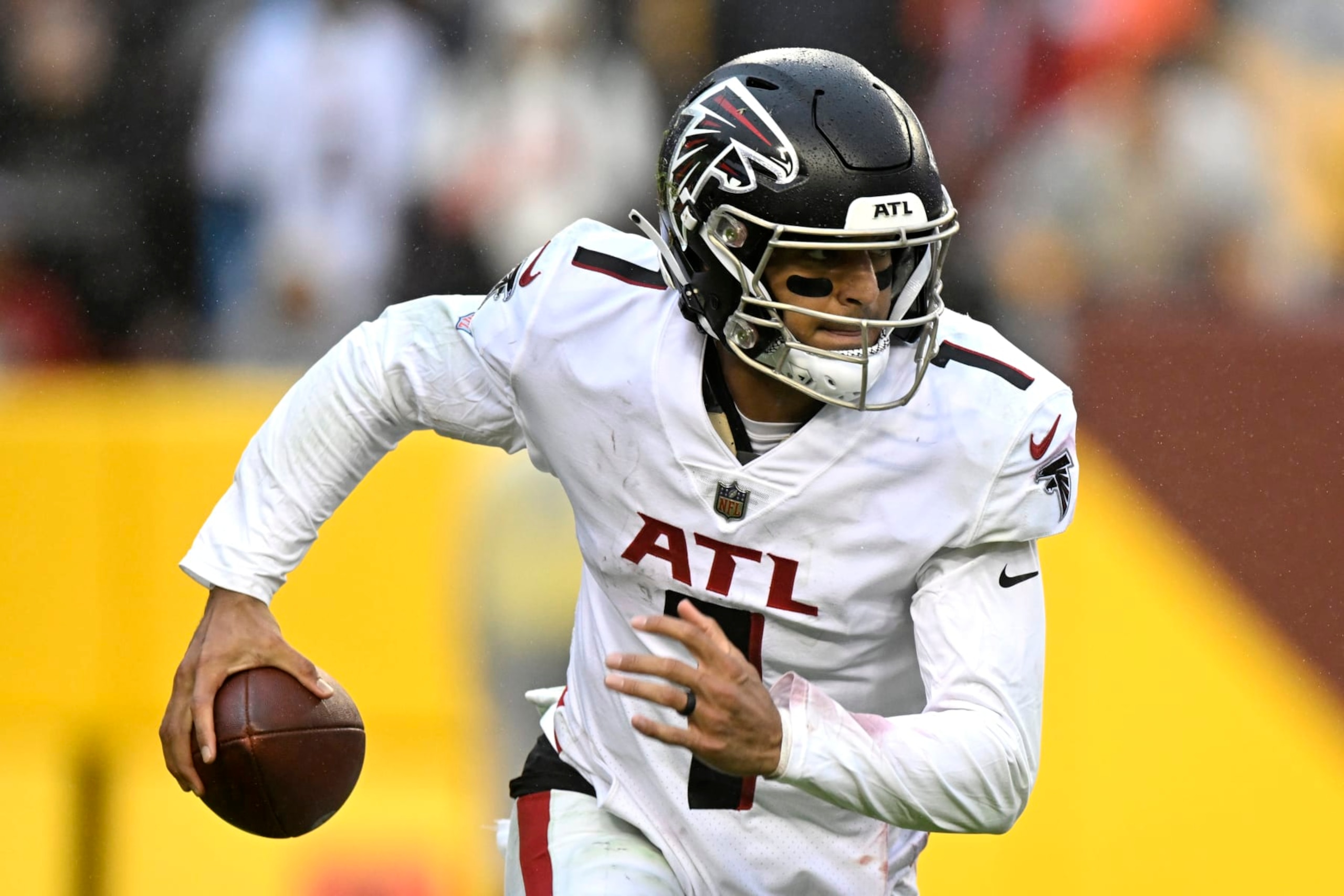LANDOVER, MARYLAND - NOVEMBER 27: Marcus Mariota #1 of the Atlanta Falcons rolls out of the pocket in the fourth quarter of a game against the Washington Commanders at FedExField on November 27, 2022 in Landover, Maryland. (Photo by Greg Fiume/Getty Images)