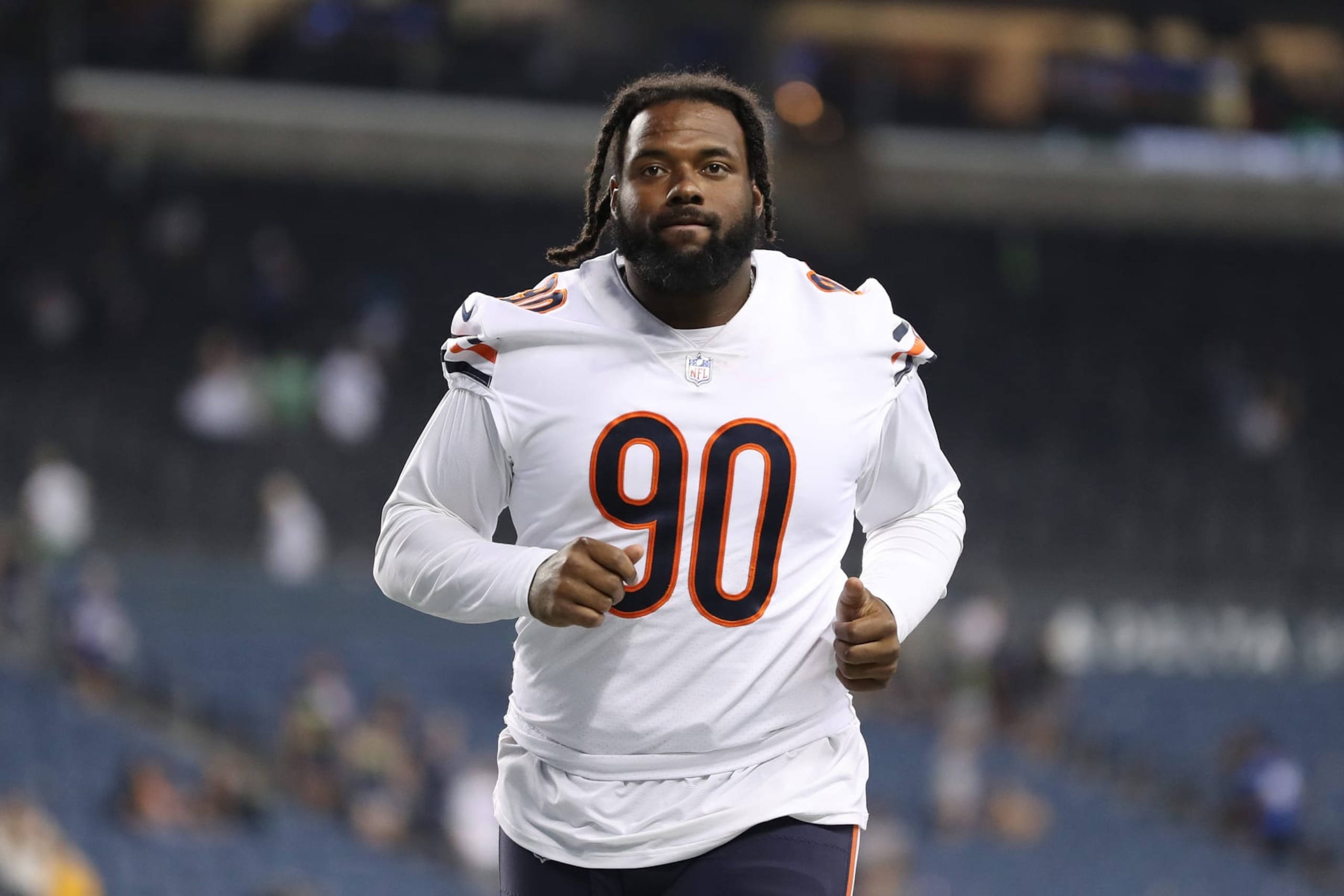 SEATTLE, WASHINGTON - AUGUST 18: Angelo Blackson #90 of the Chicago Bears jogs off the field during the preseason game between the Seattle Seahawks and the Chicago Bears at Lumen Field on August 18, 2022 in Seattle, Washington. (Photo by Steph Chambers/Getty Images)